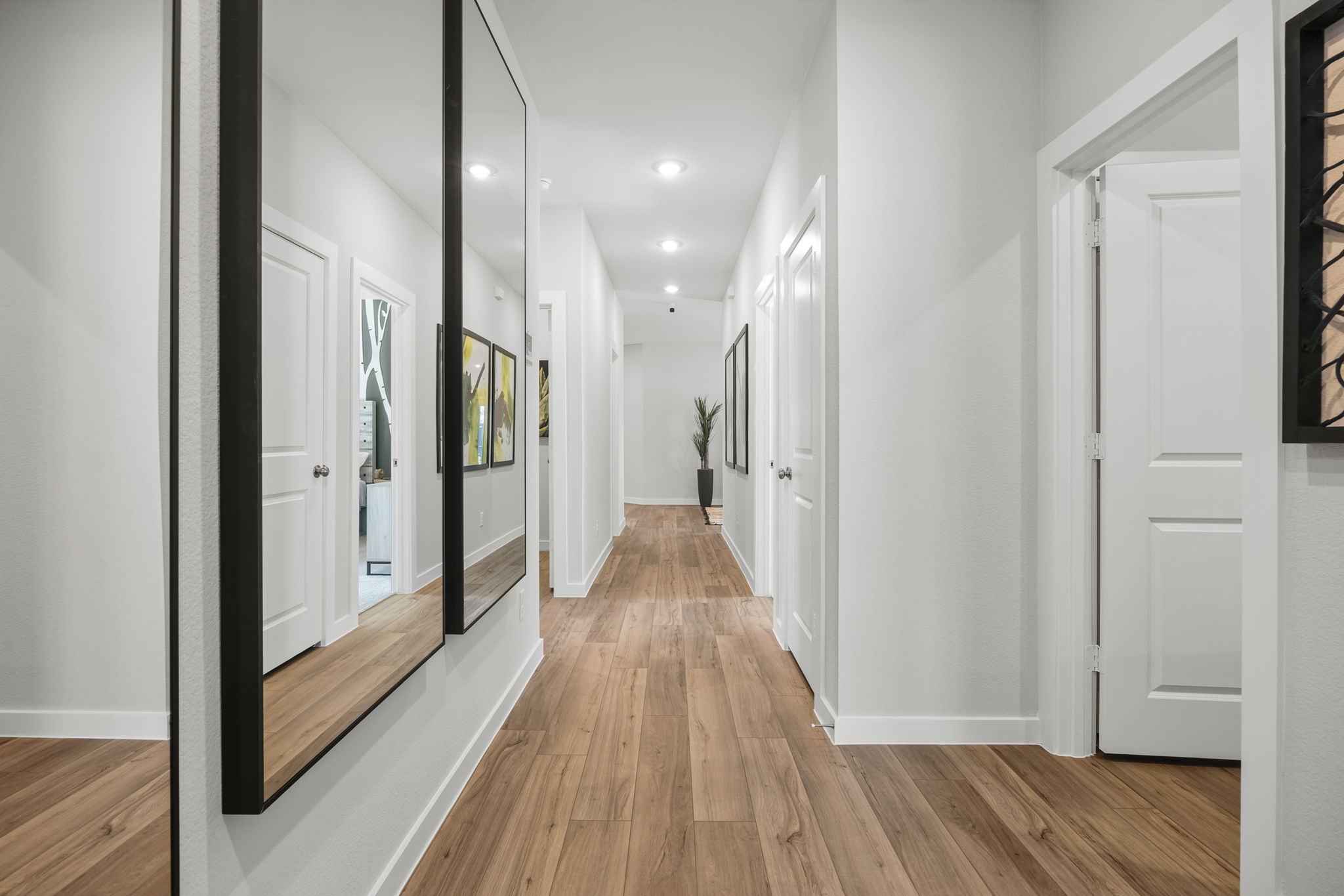 A hallway with white doors.