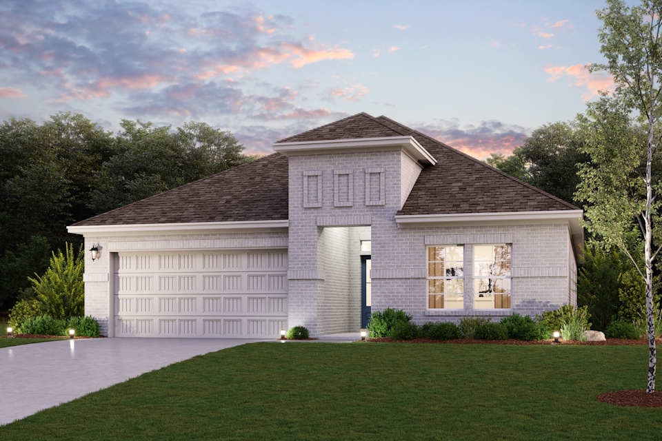A house with a lawn in front of it.