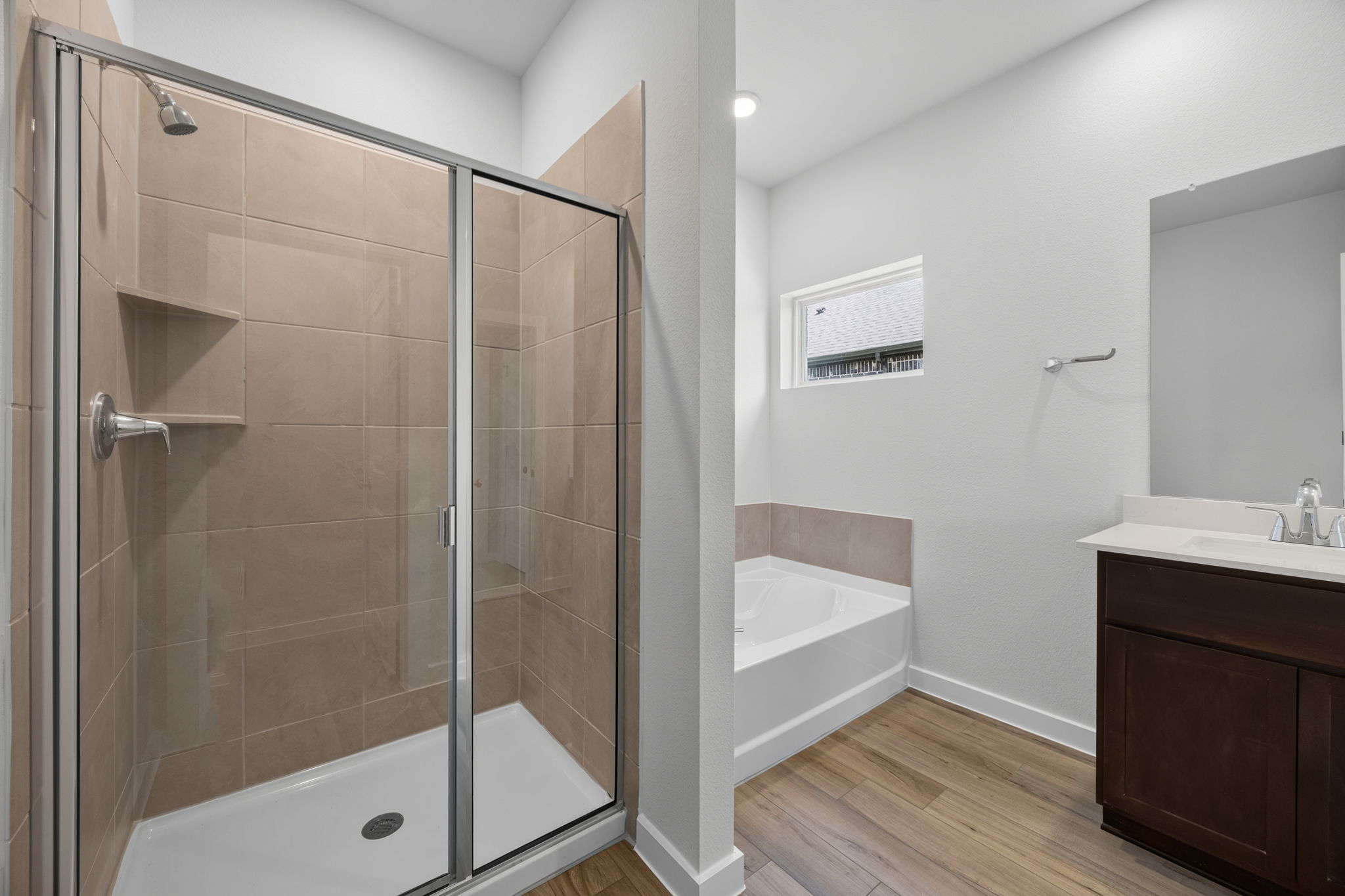 A bathroom with a glass shower.