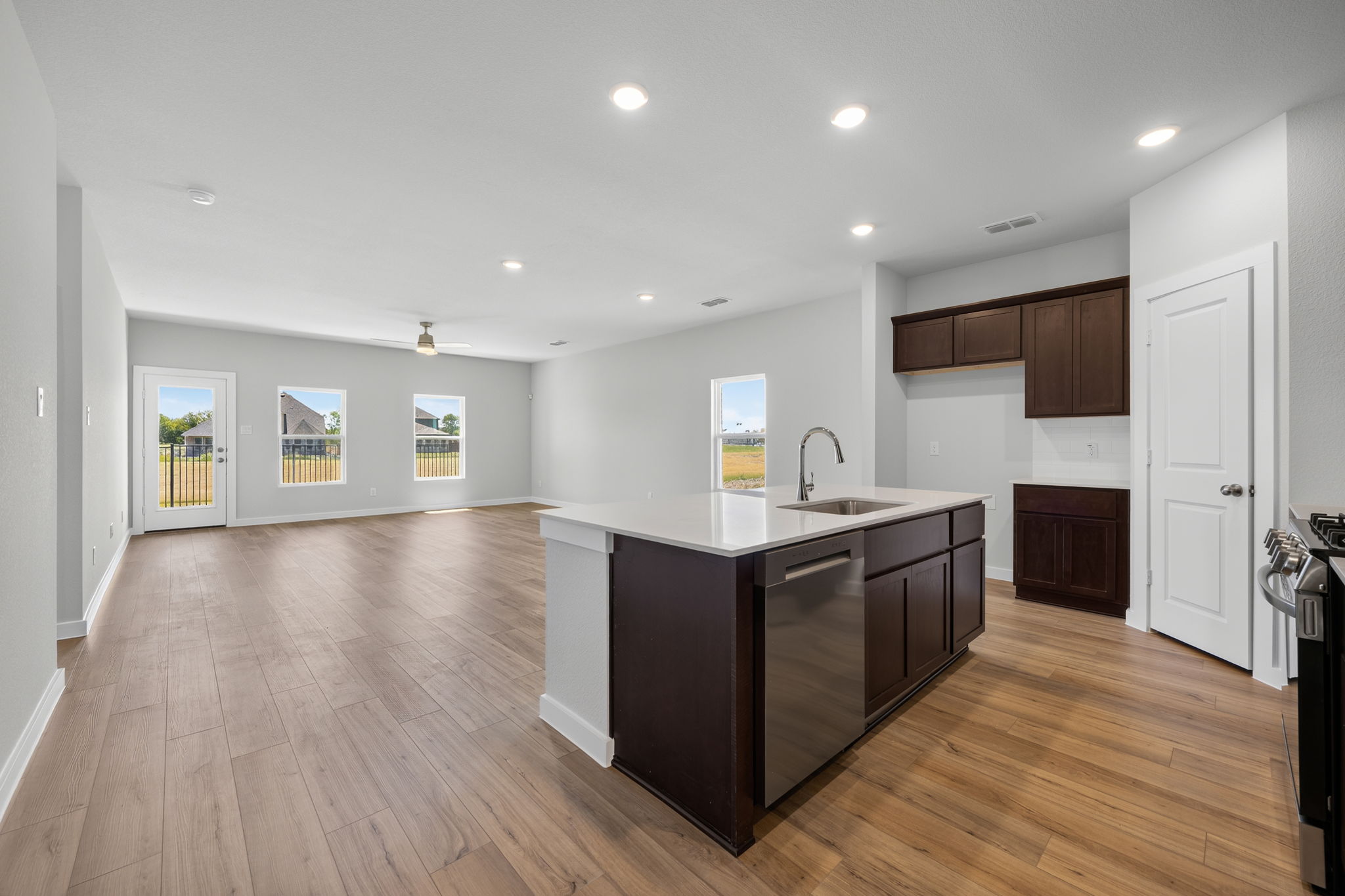 A kitchen with wooden floors.