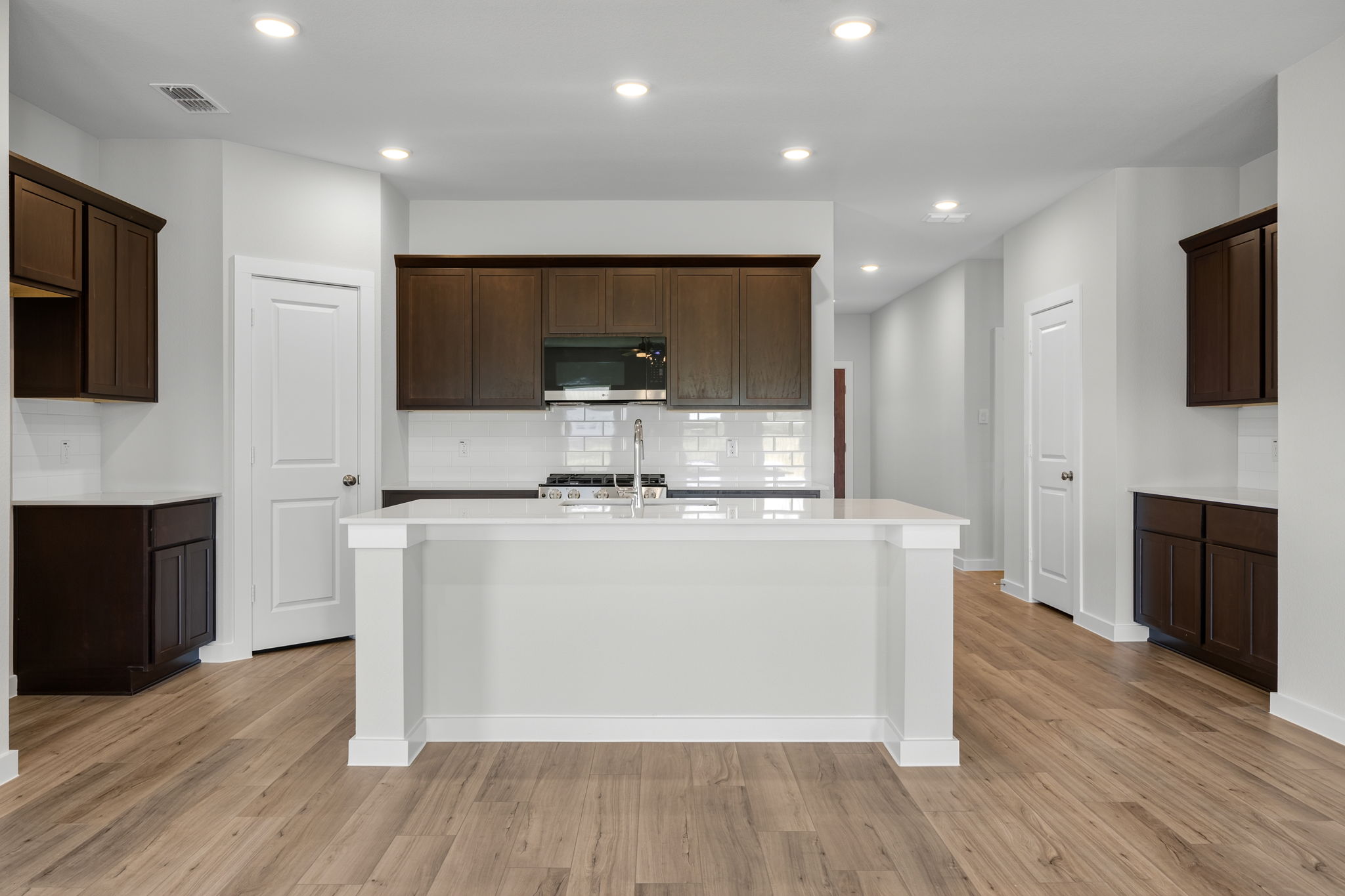 A kitchen with a white counter.