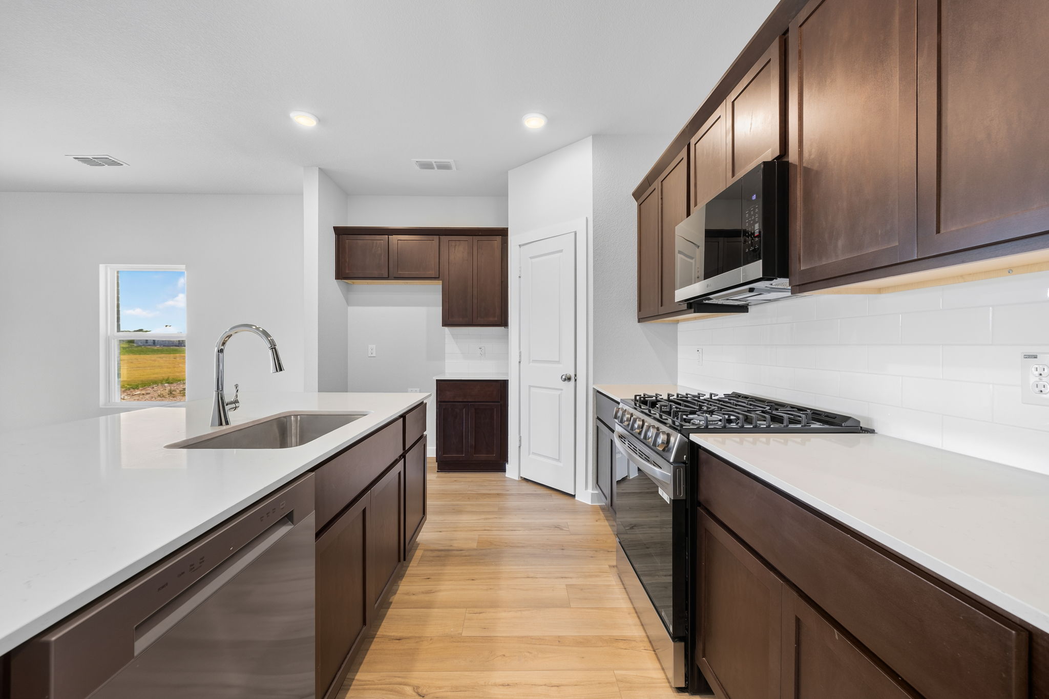 A kitchen with black appliances.