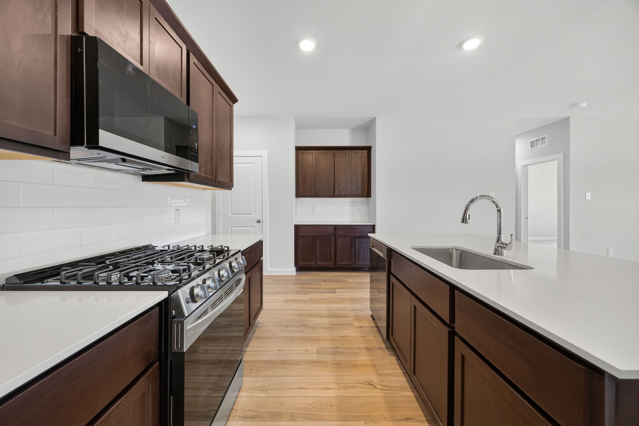 A kitchen with a stove and oven.