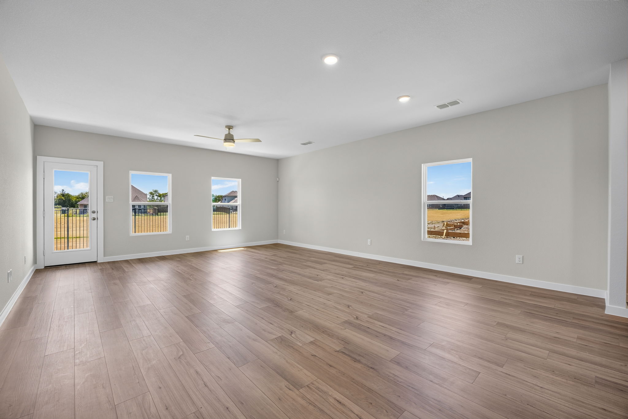 A room with a wood floor and a wood floor with a wood floor.