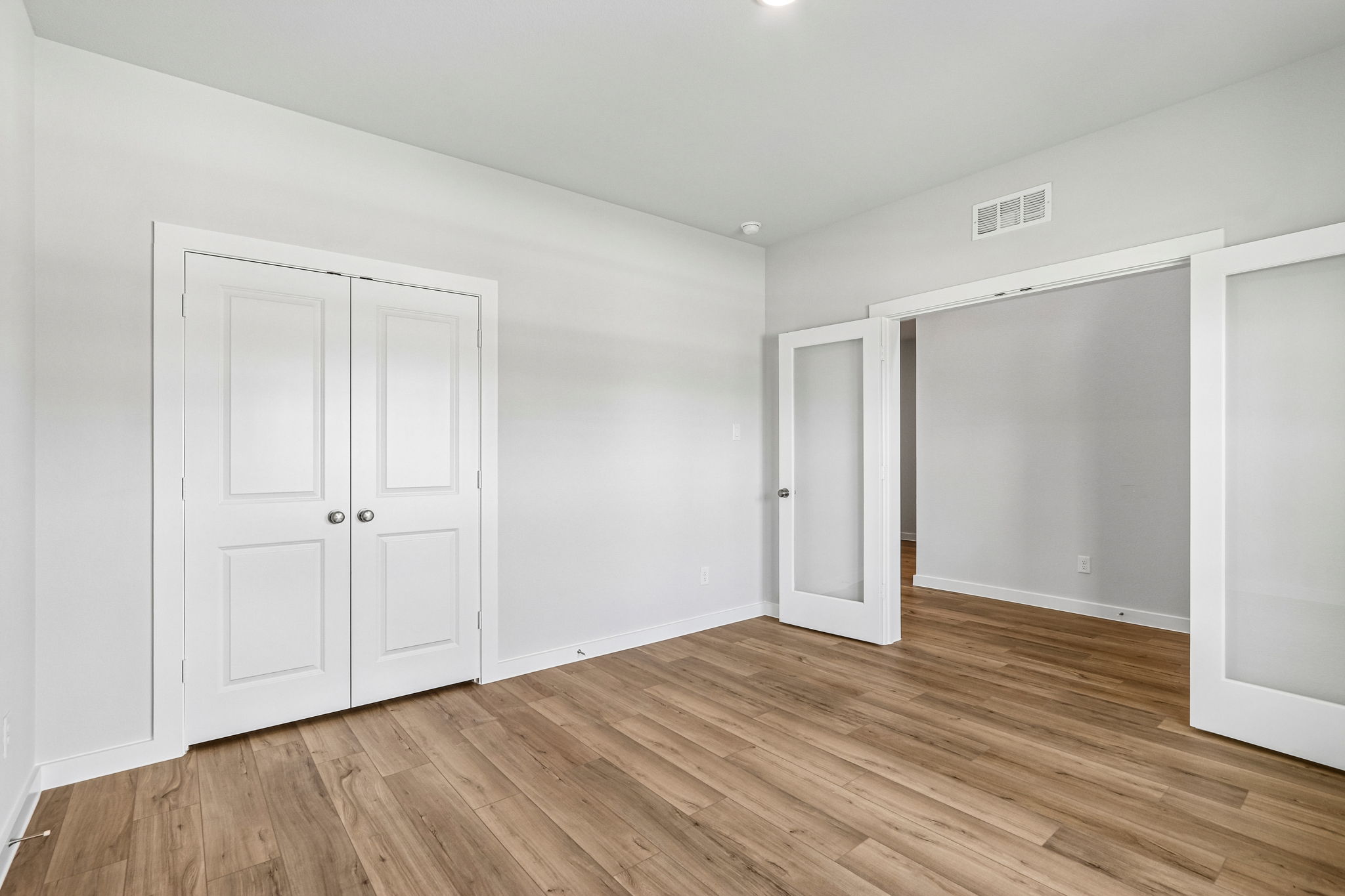 A room with white doors.