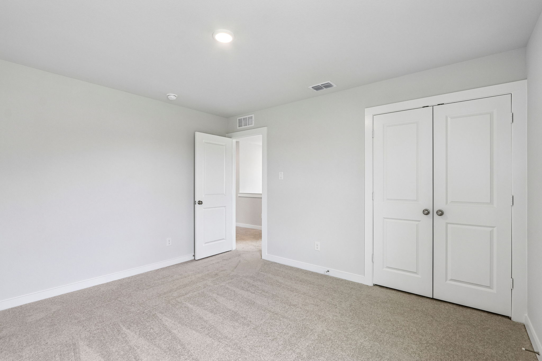 A room with white doors.