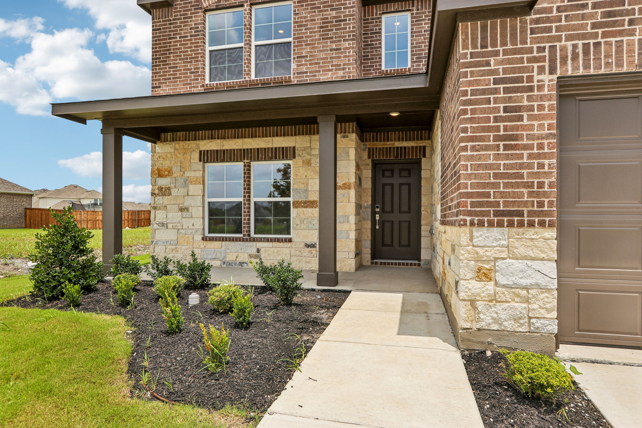 A brick building with a walkway.