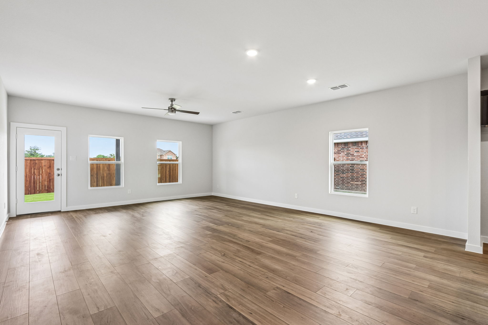 A room with a wood floor and a wood floor.