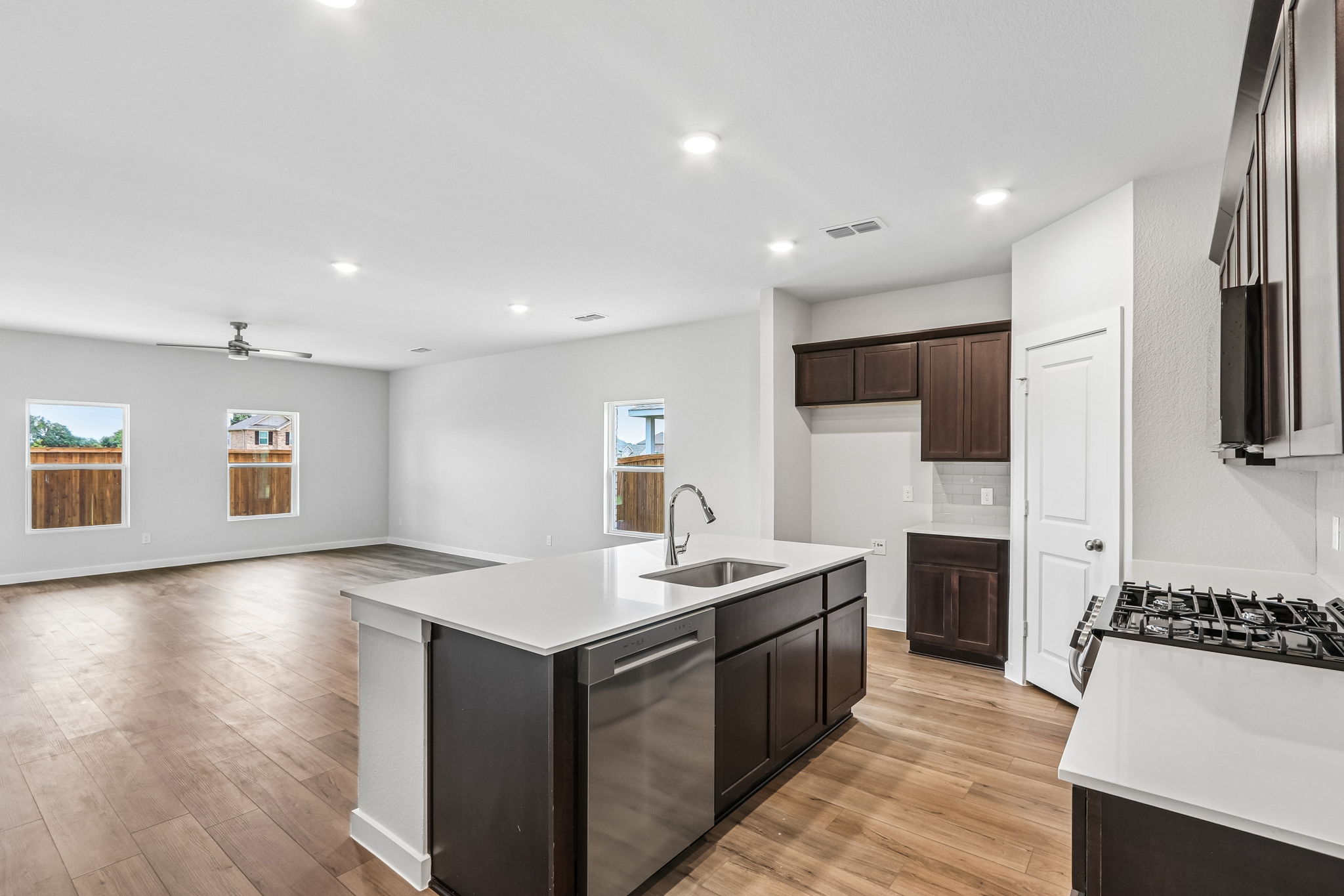A kitchen with a wood floor.