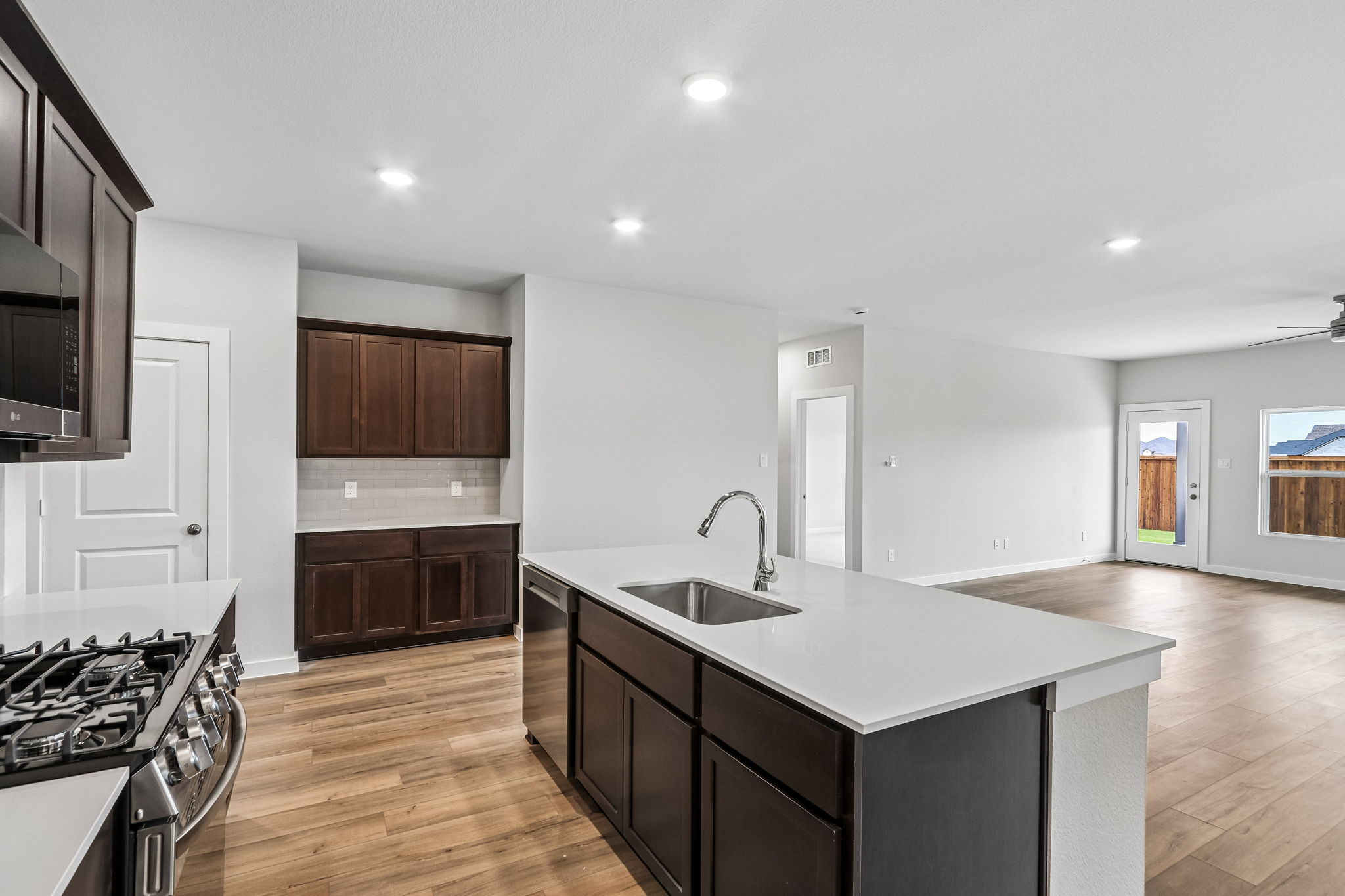 A kitchen with wooden cabinets.