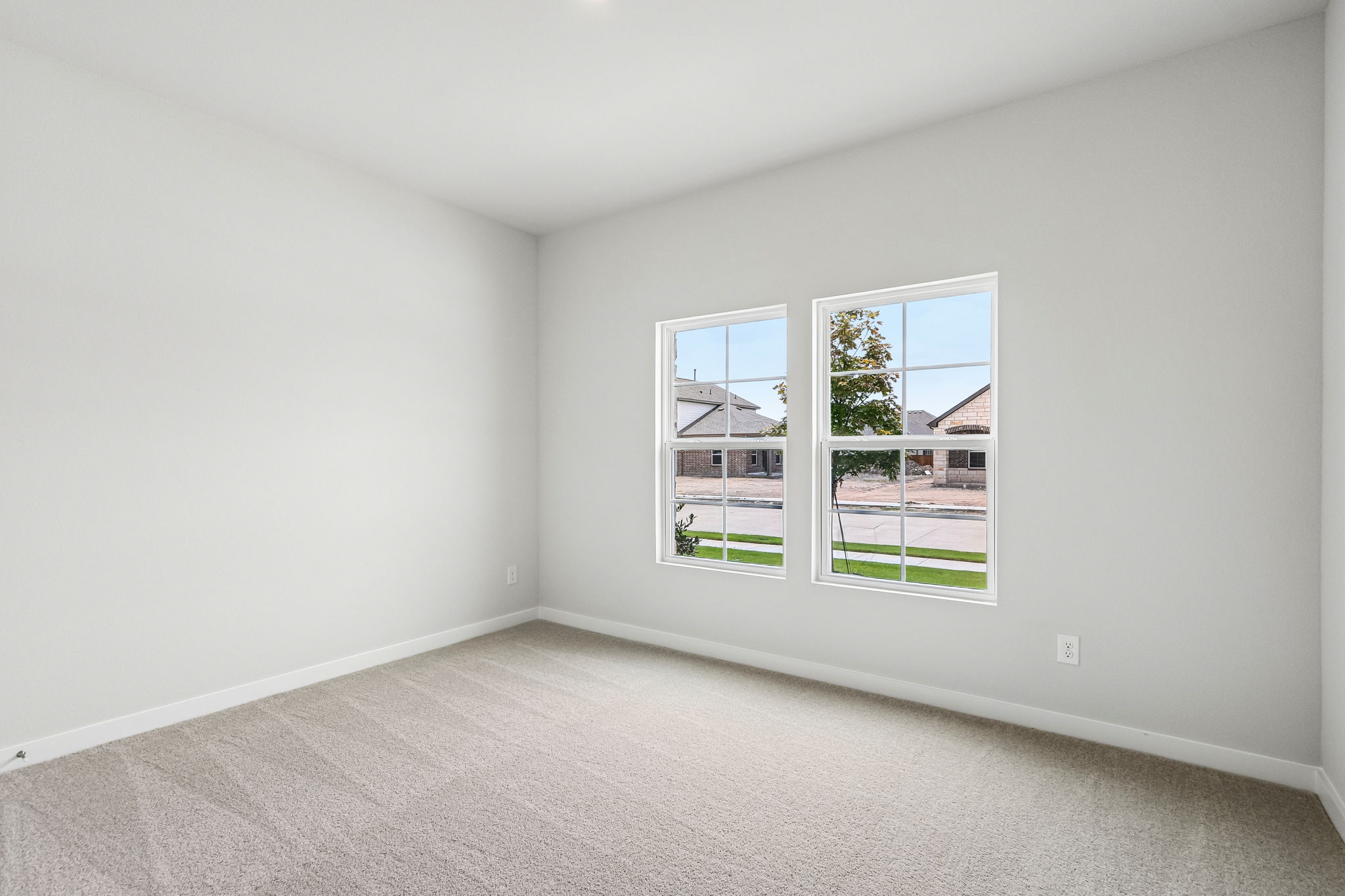 A room with a window and a door.
