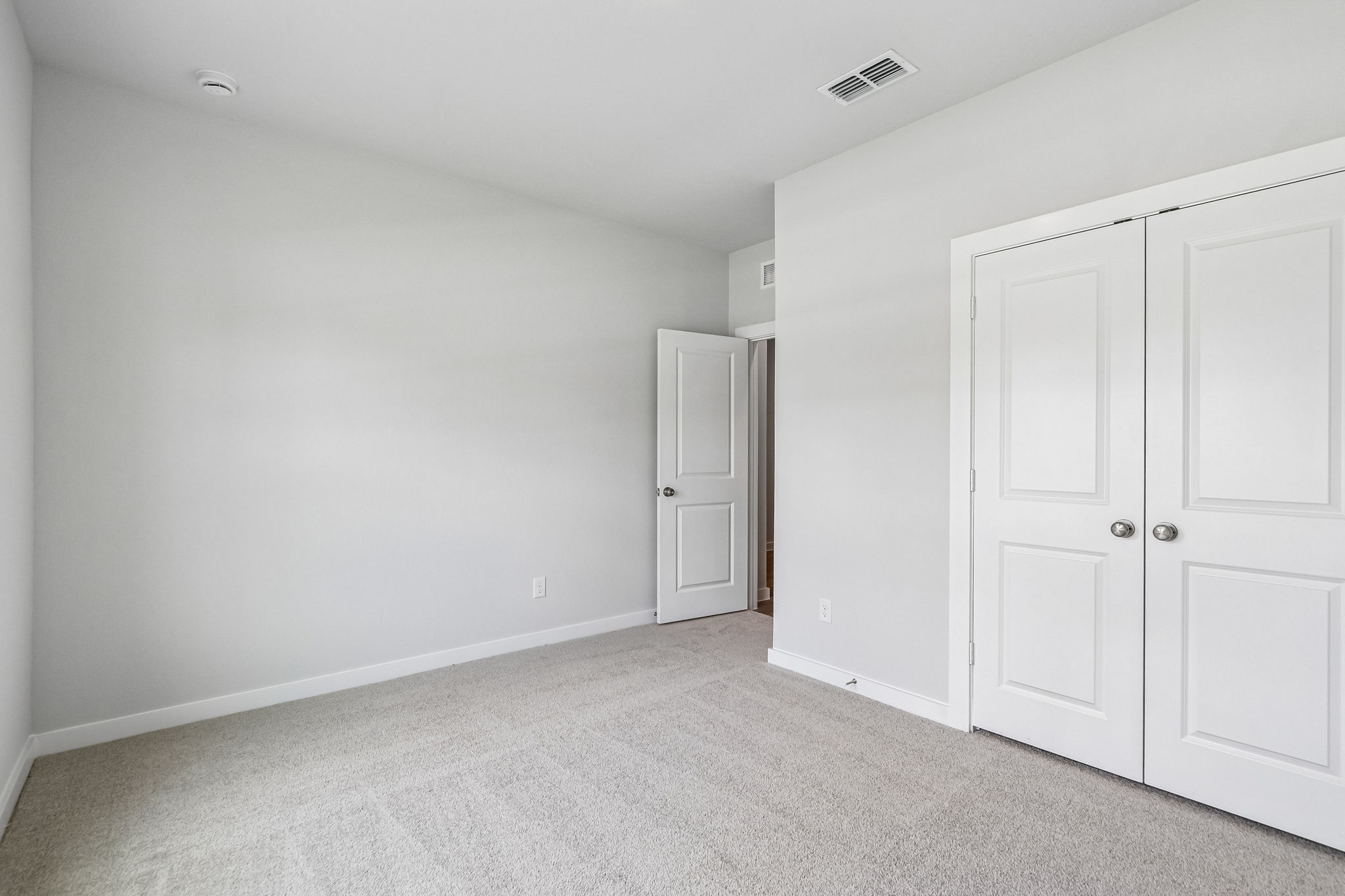 A room with white doors.