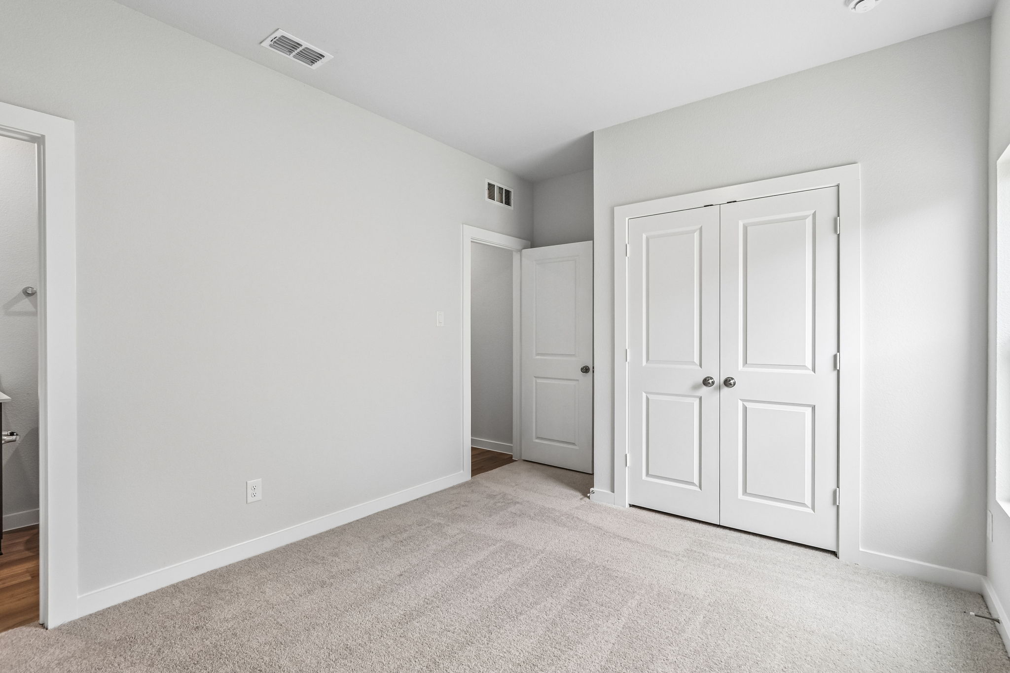 A room with white doors.