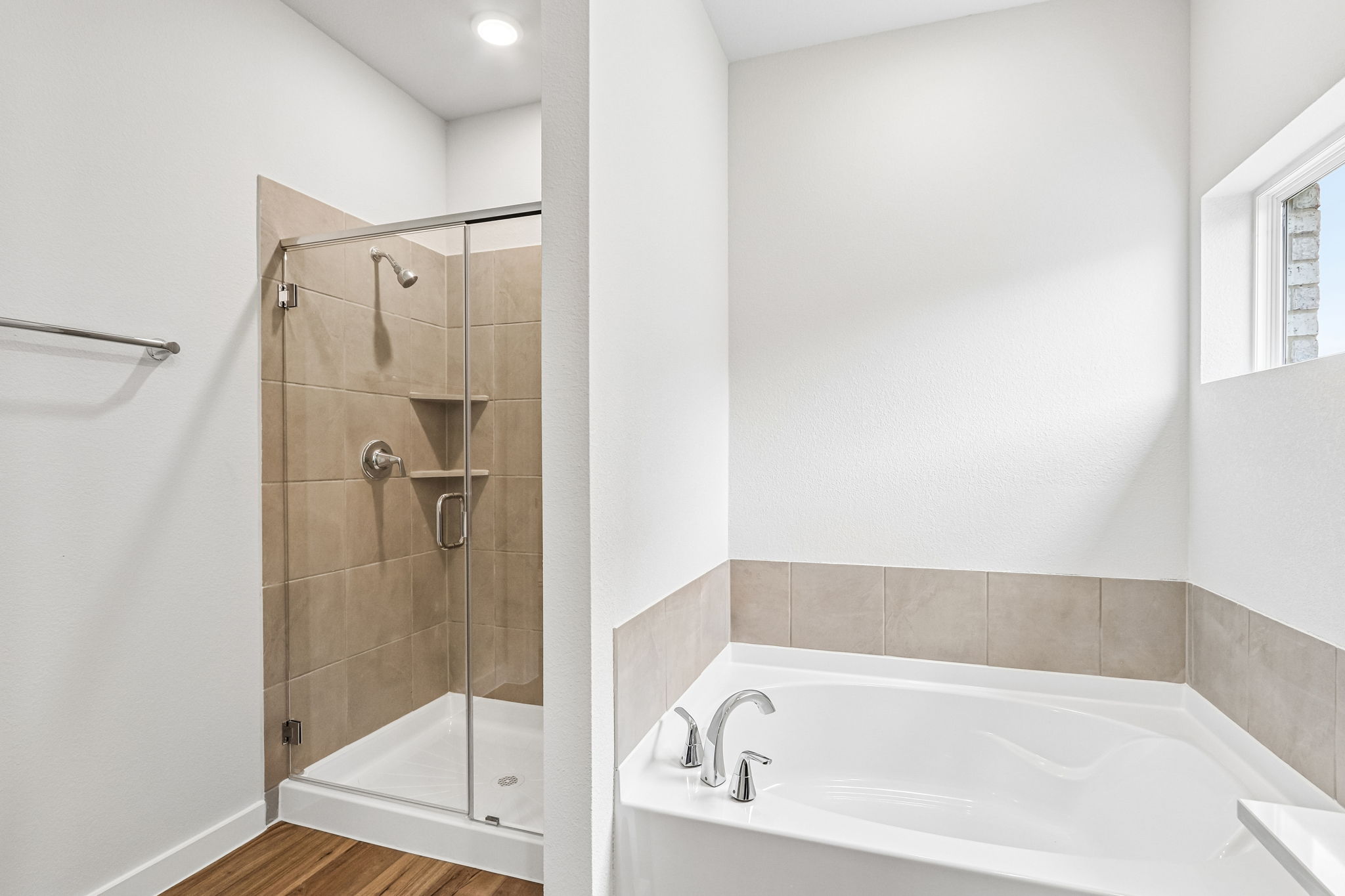 A bathroom with a glass shower.