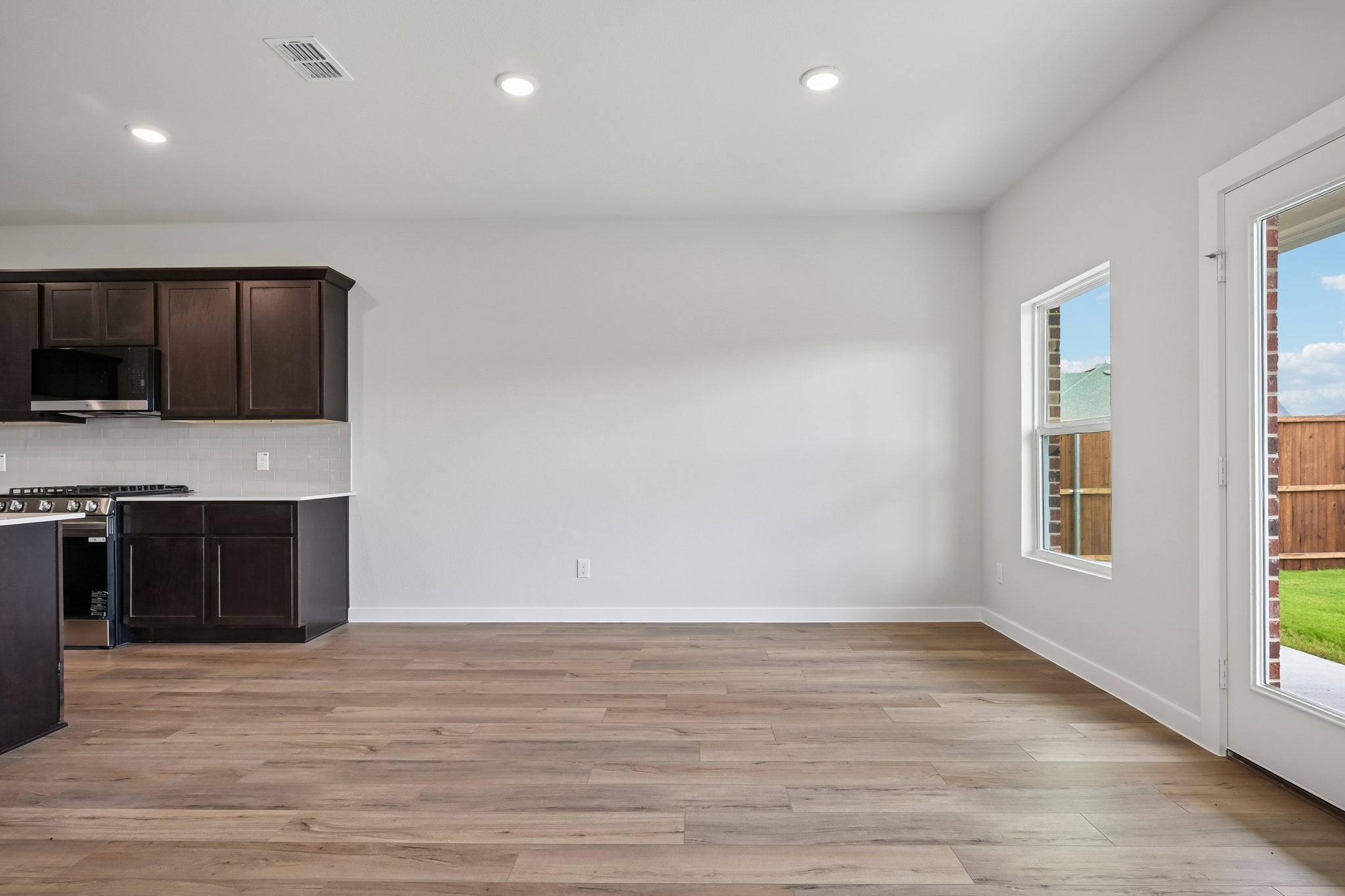 A kitchen with wooden floors.