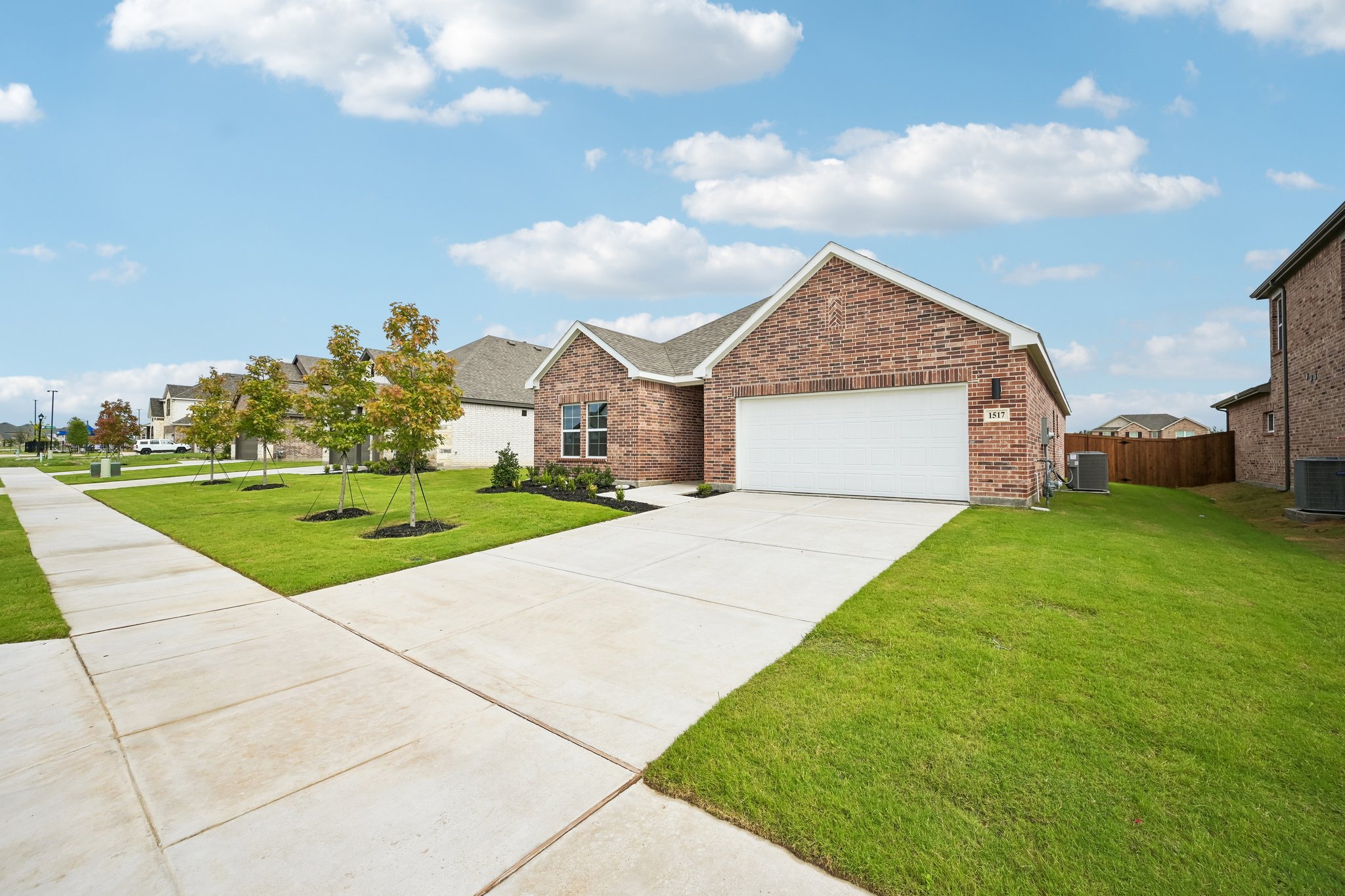 A driveway leading to a house.