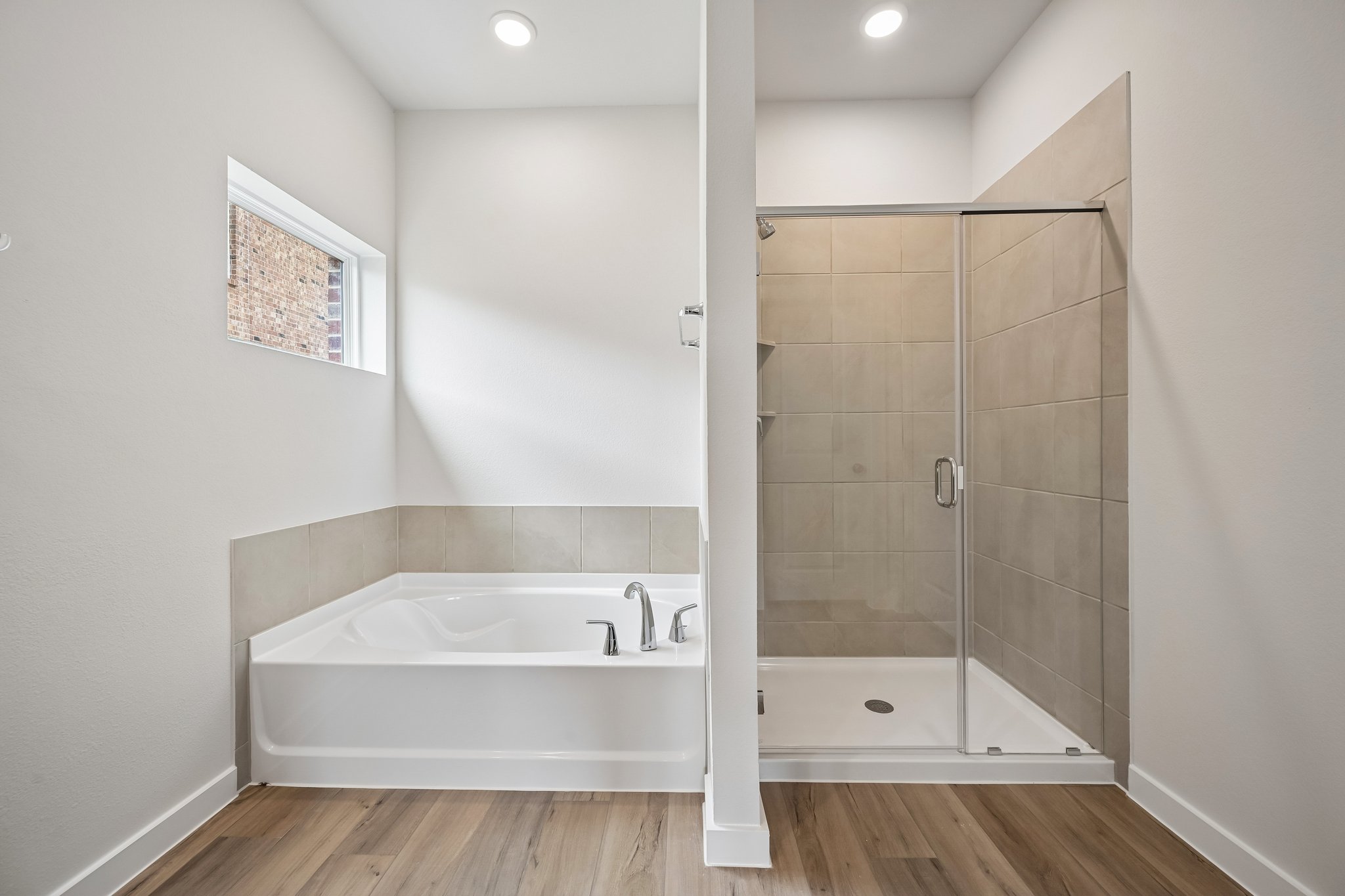 A bathroom with a glass shower.