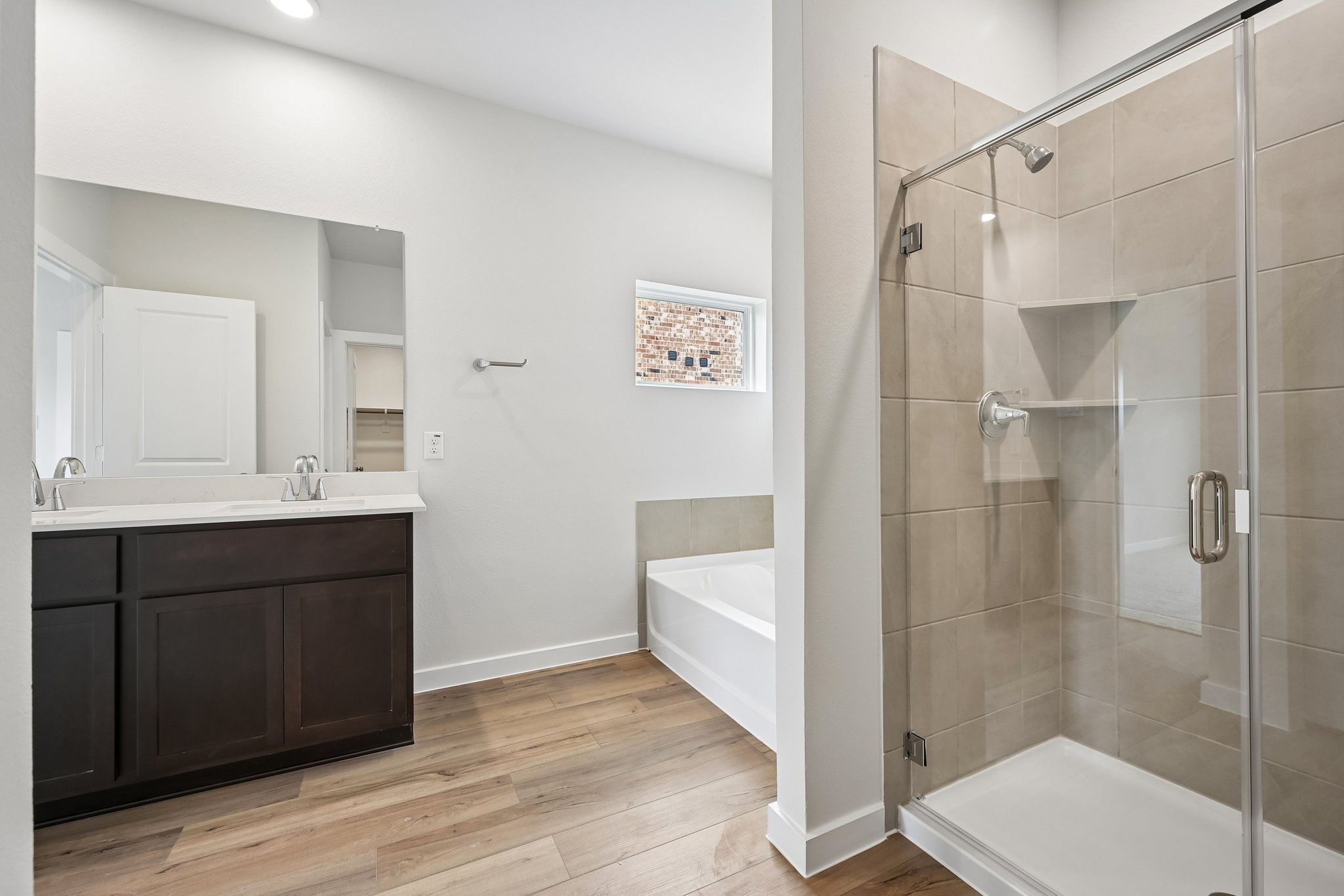 A bathroom with a glass shower.