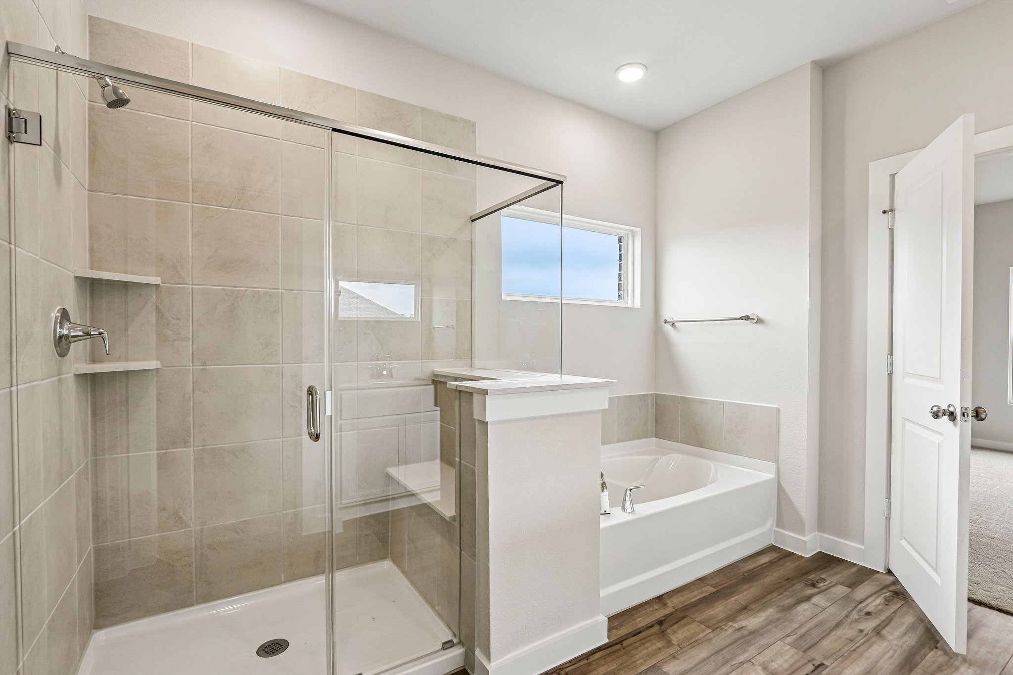 A bathroom with a glass shower.