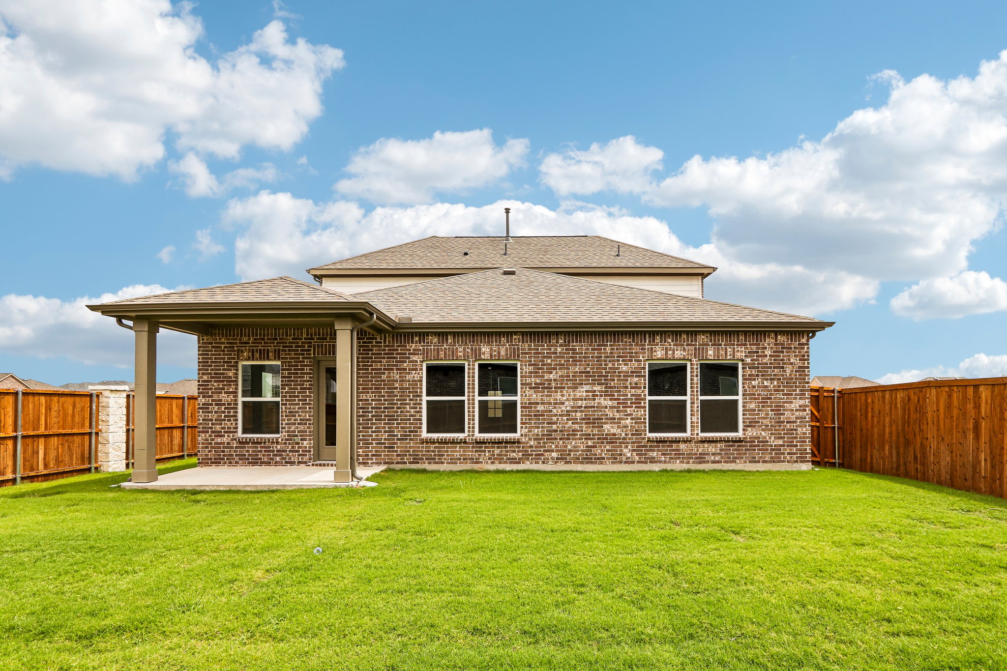 A house with a grass yard.