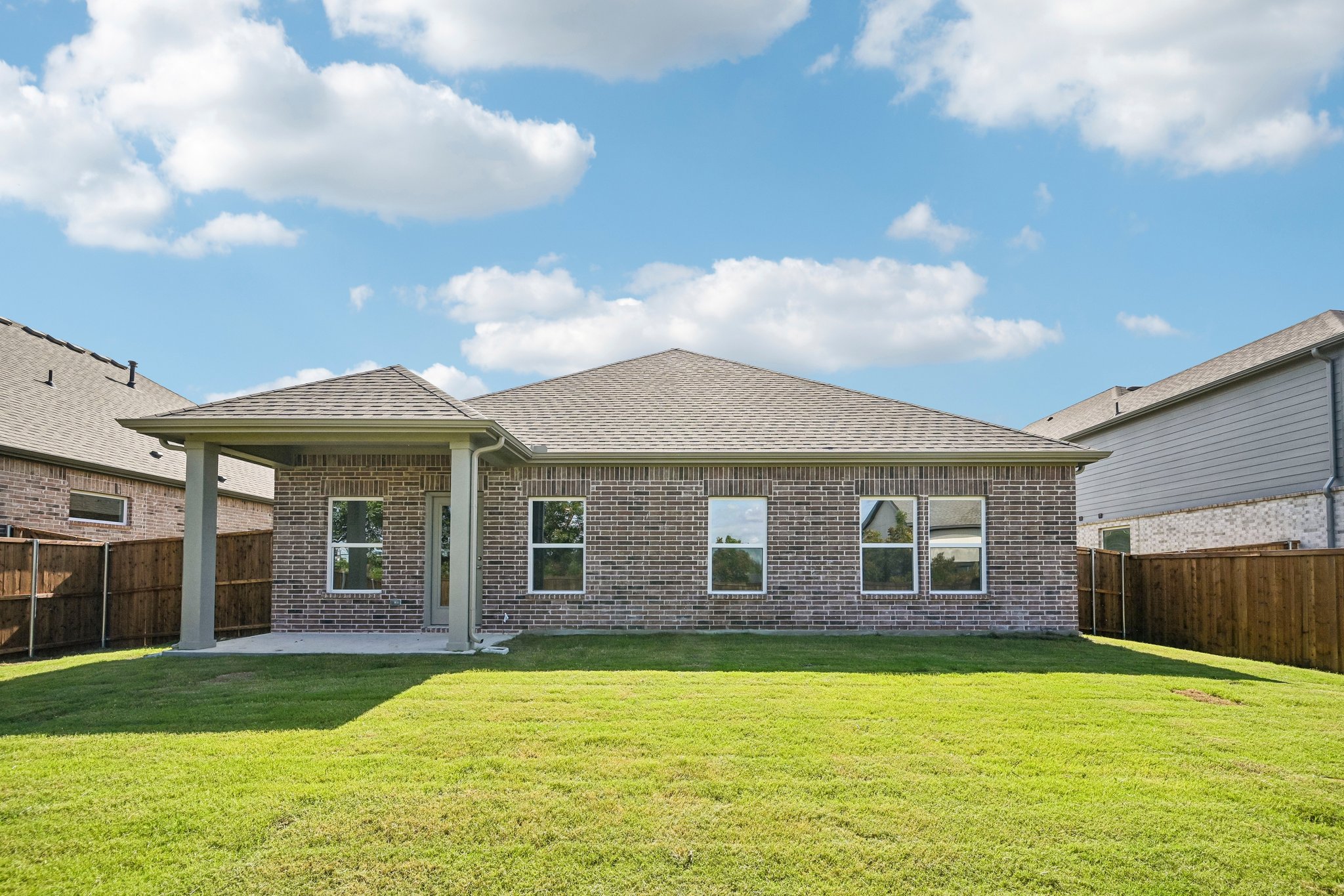 A house with a large front yard.