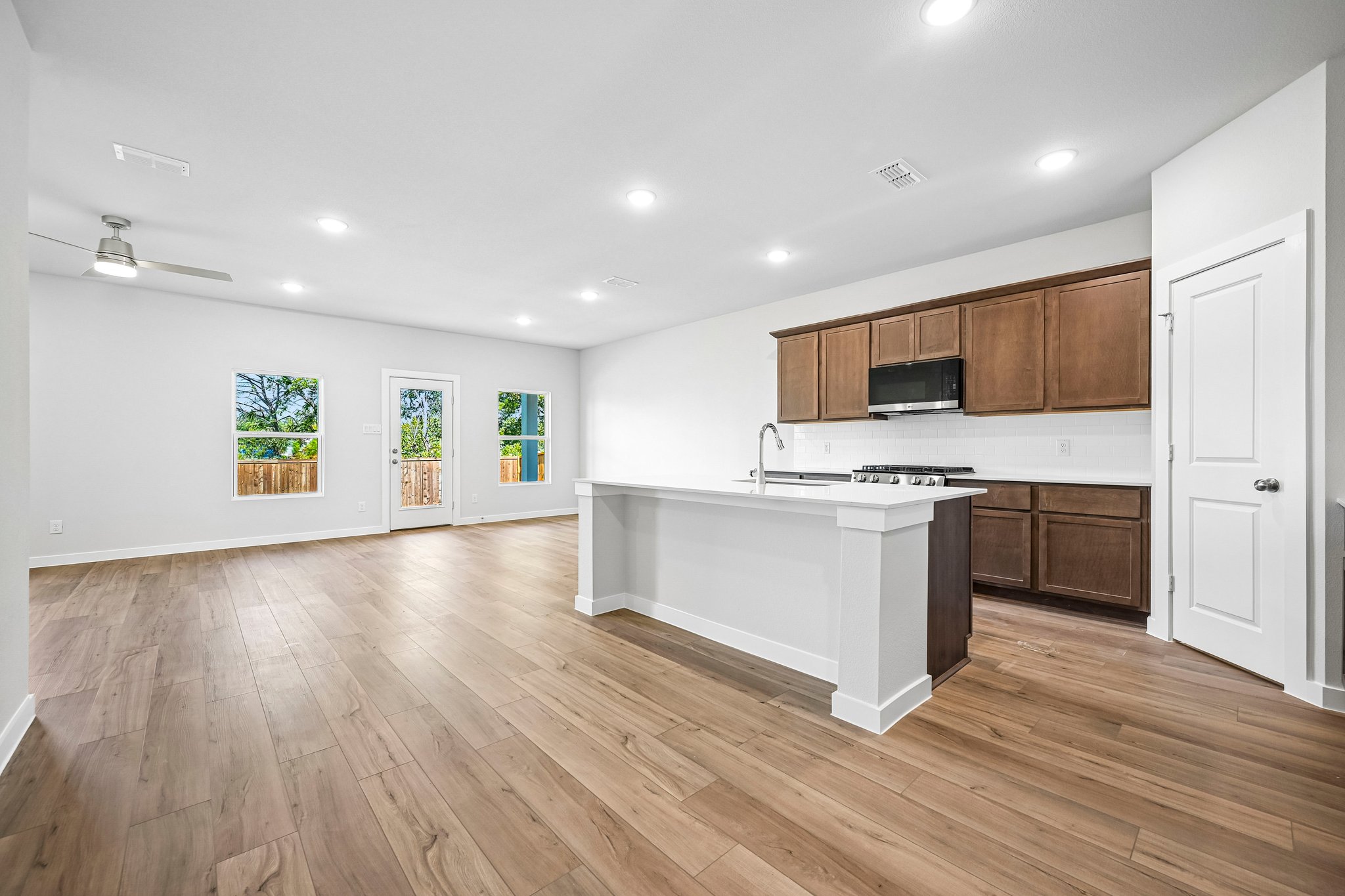 A kitchen with wooden floors.