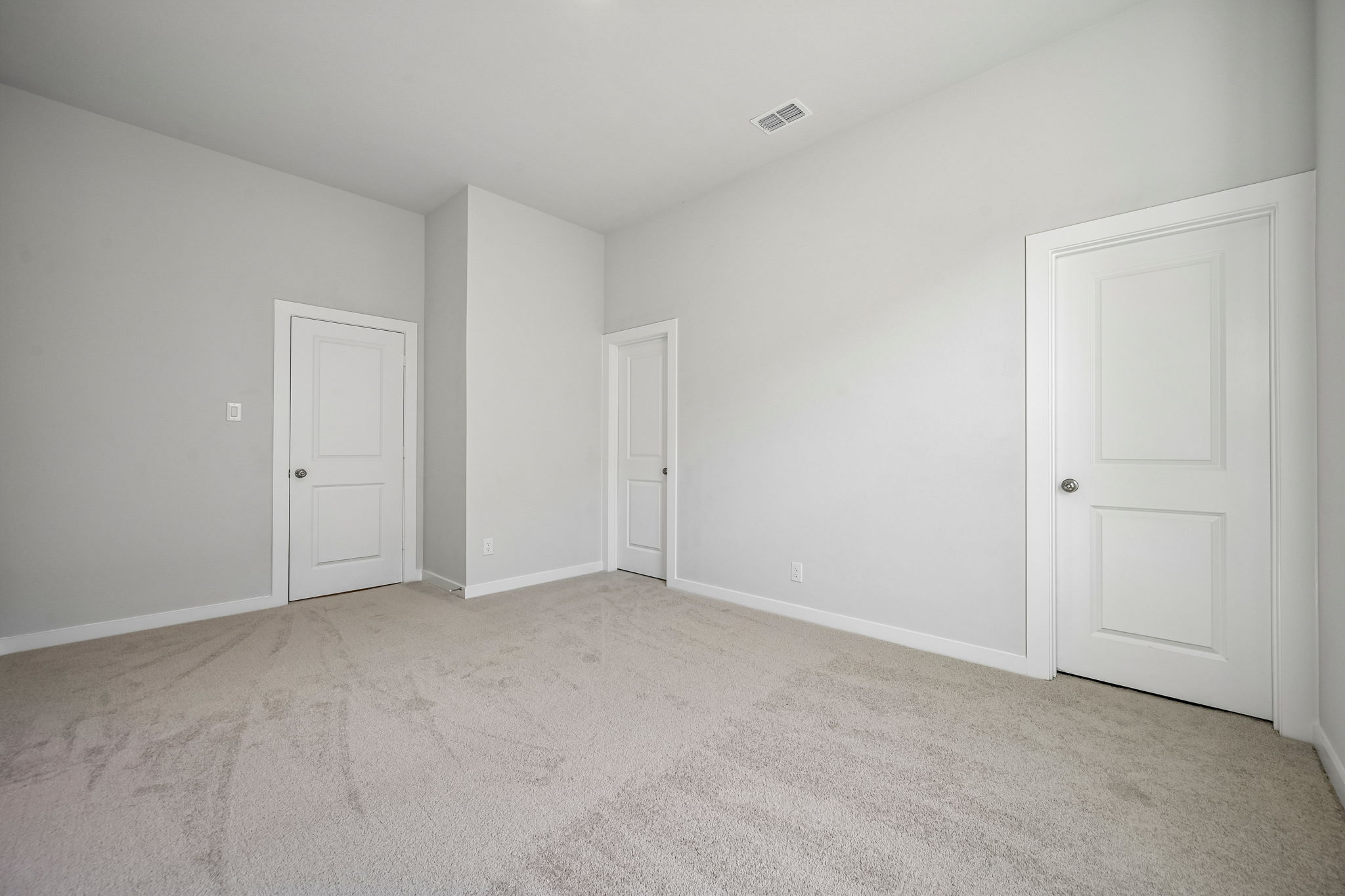 A room with white doors.