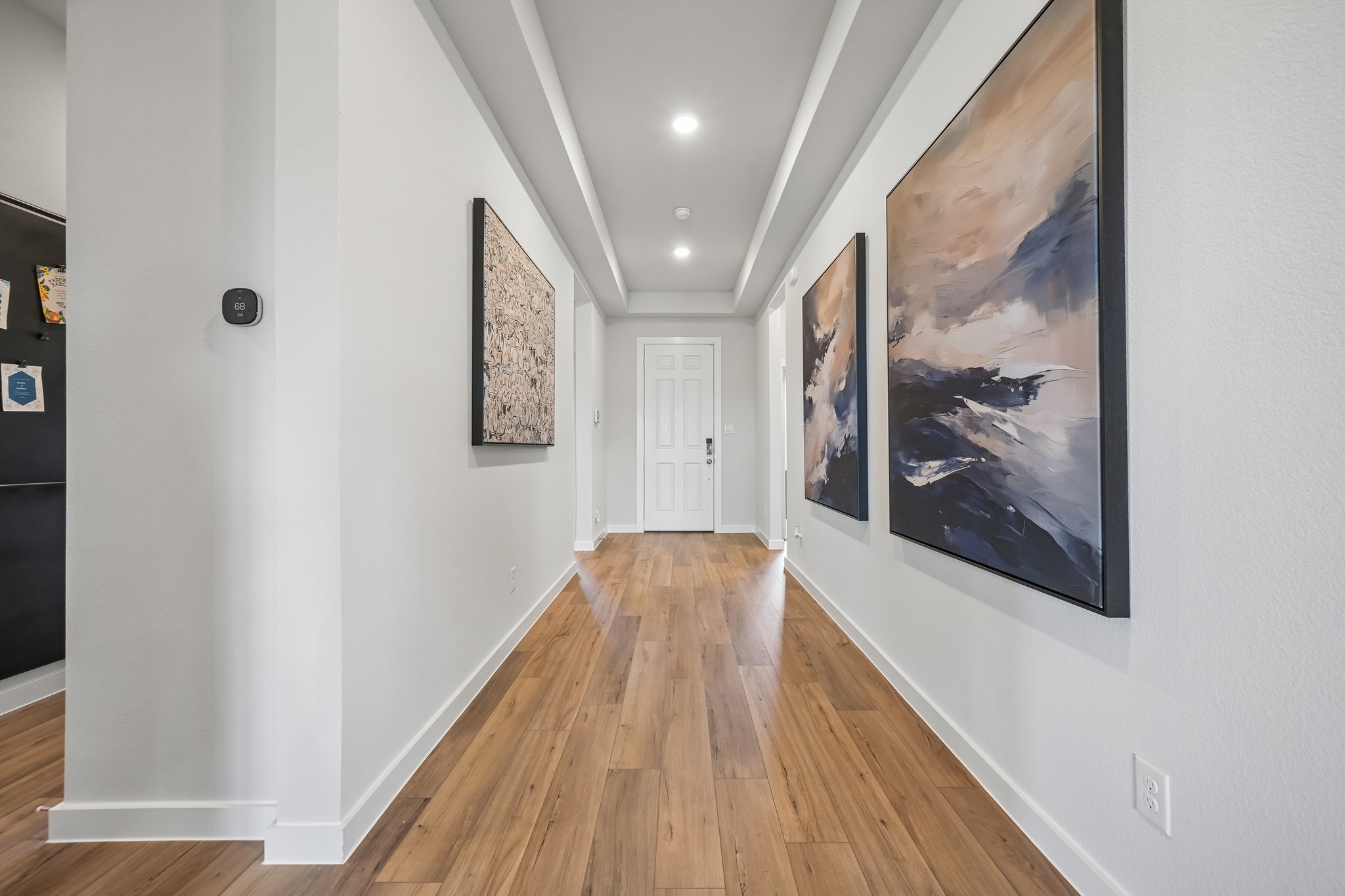 A room with art on the wall.