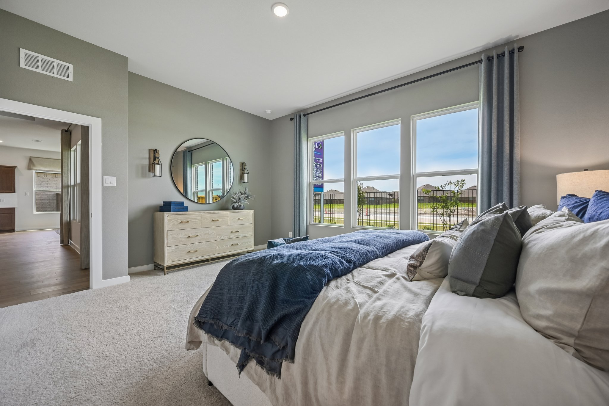 A bedroom with a large bed.