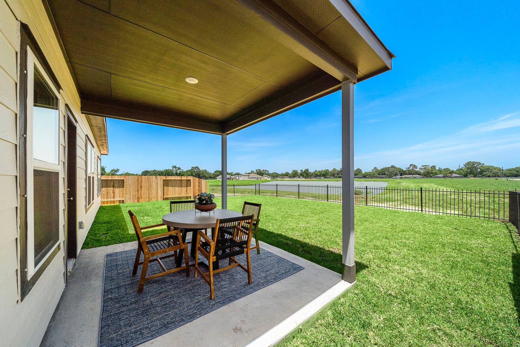 A table and chairs on a deck.