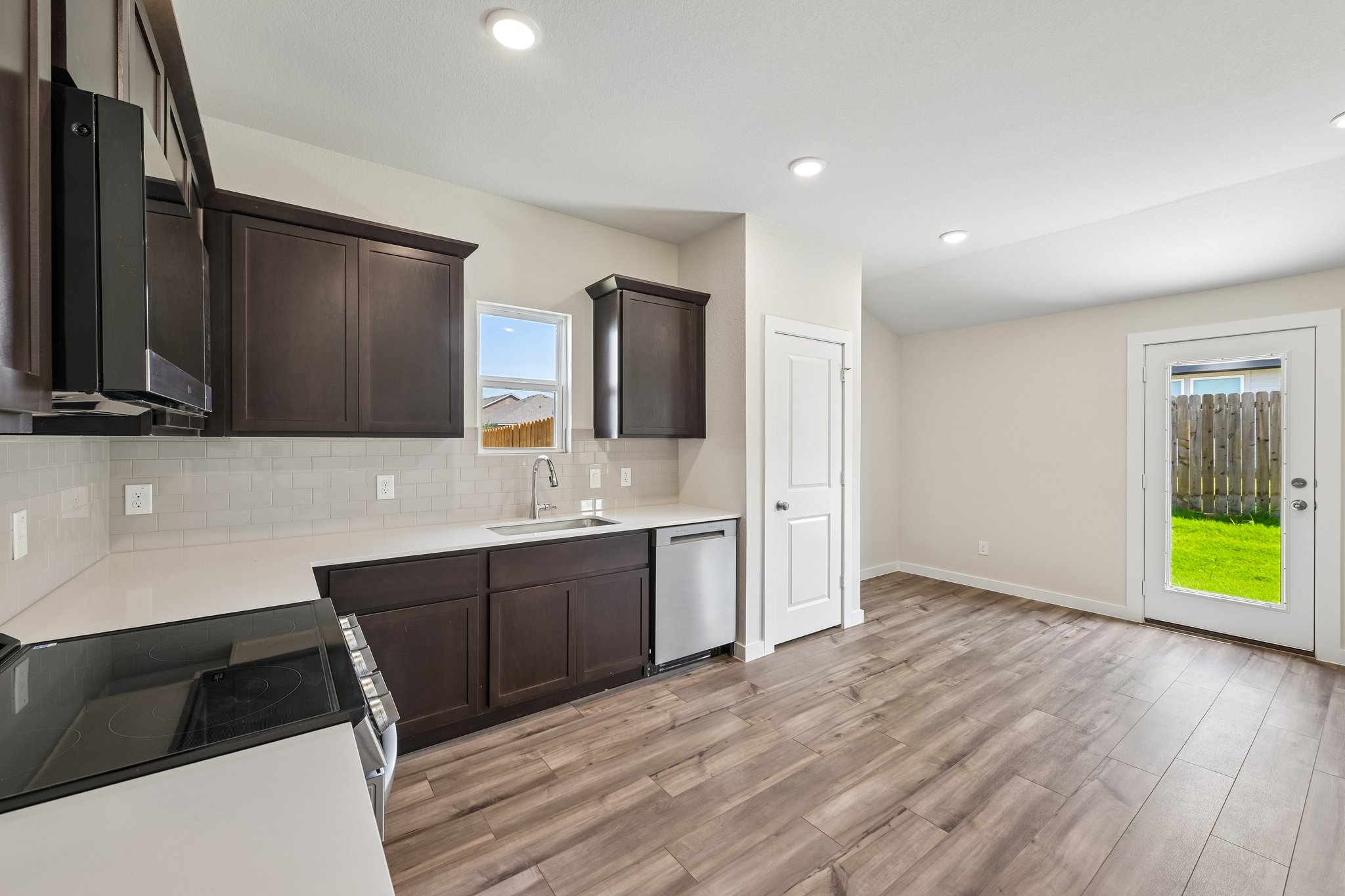 A kitchen with wooden floors.