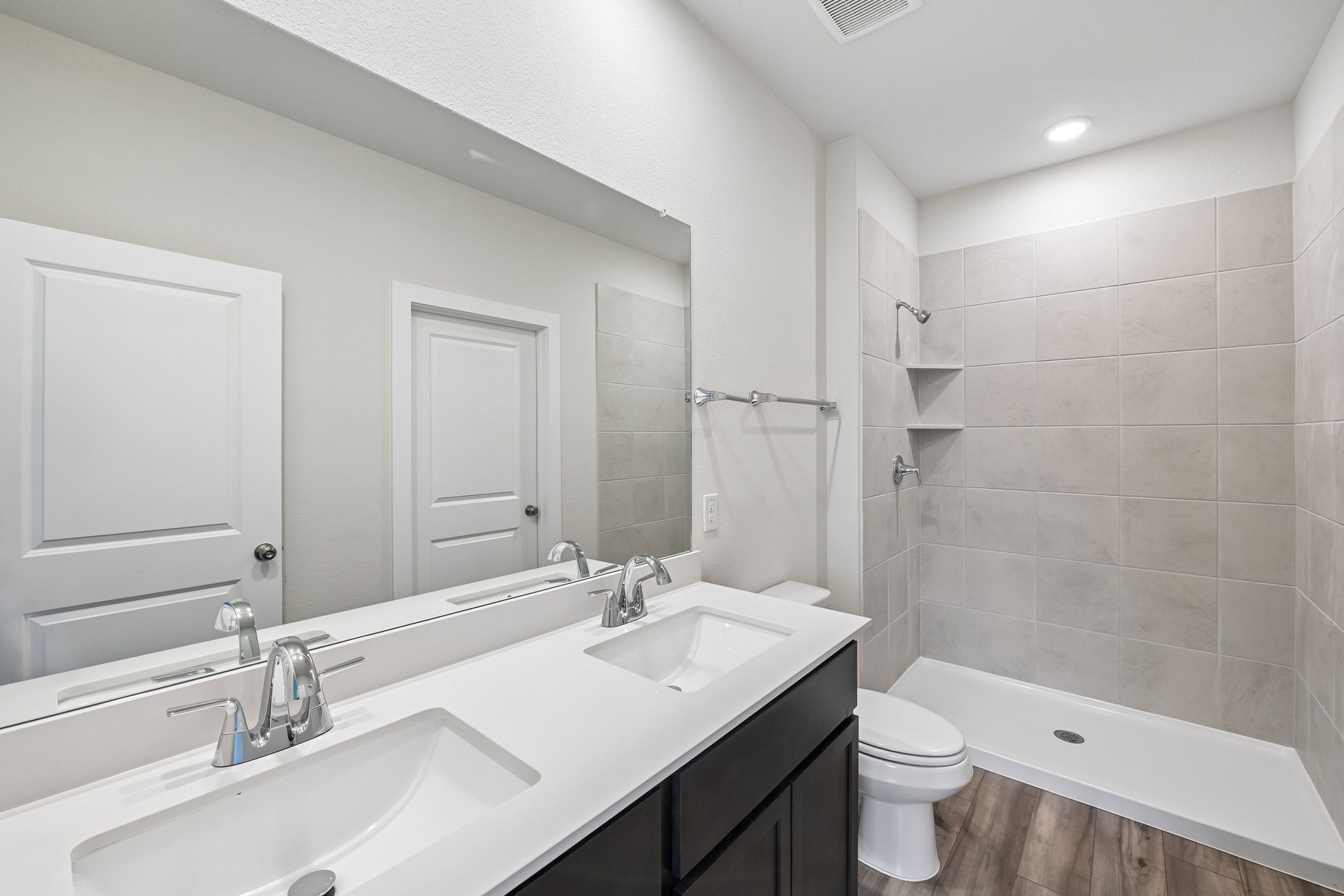 A bathroom with a tub sink and toilet.