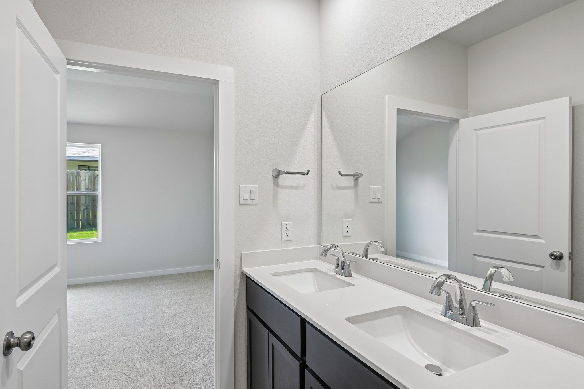 A bathroom with two sinks.