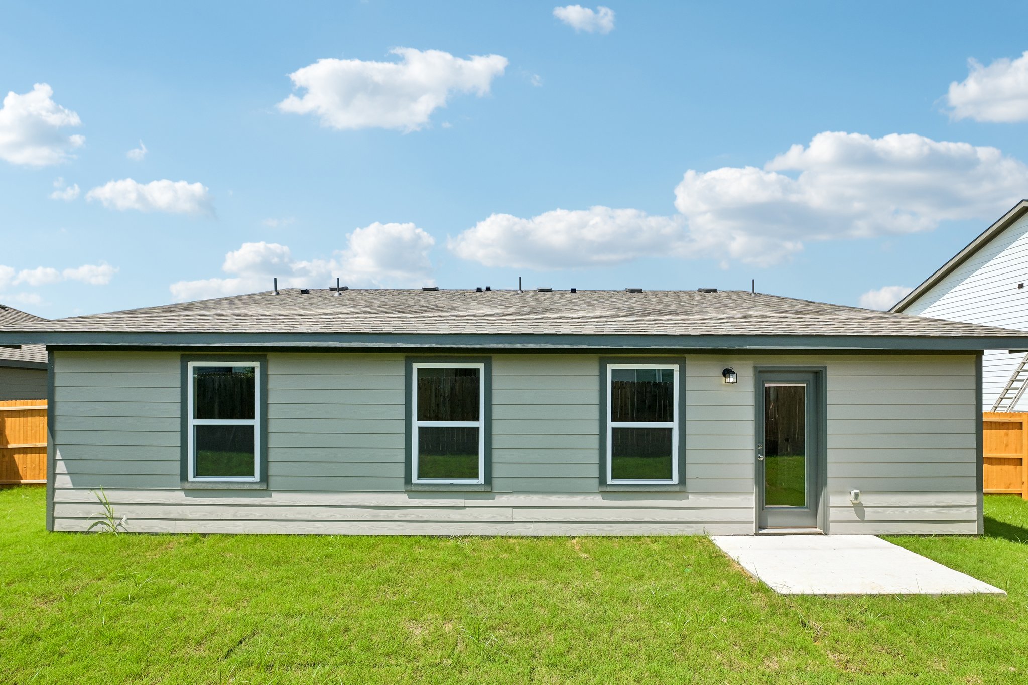 A house with a grass yard.