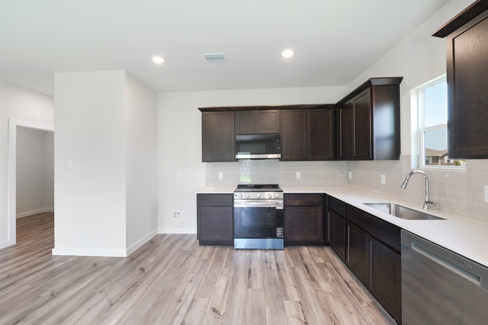 A kitchen with black appliances.
