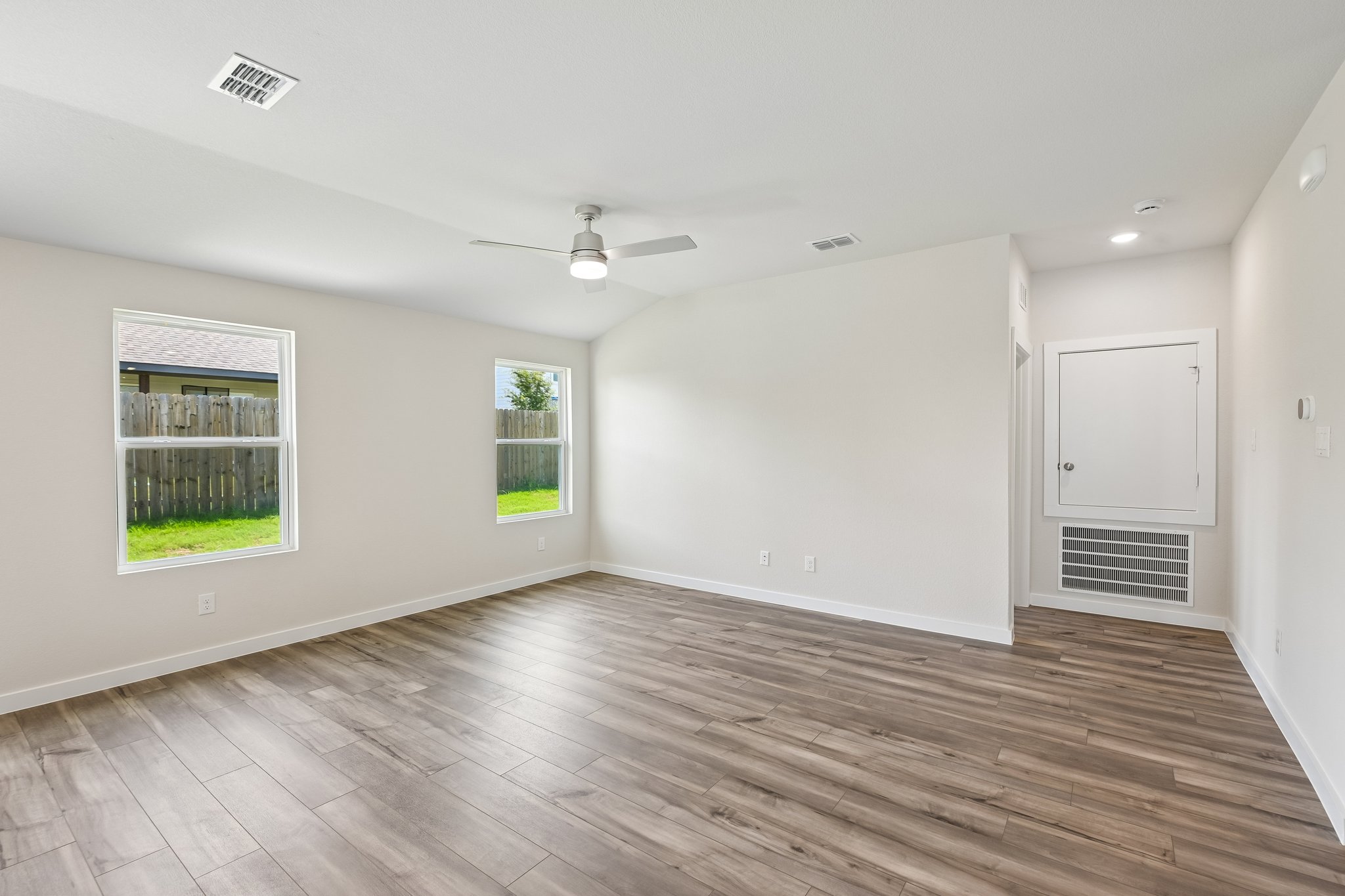 A room with a wood floor and a wood floor.