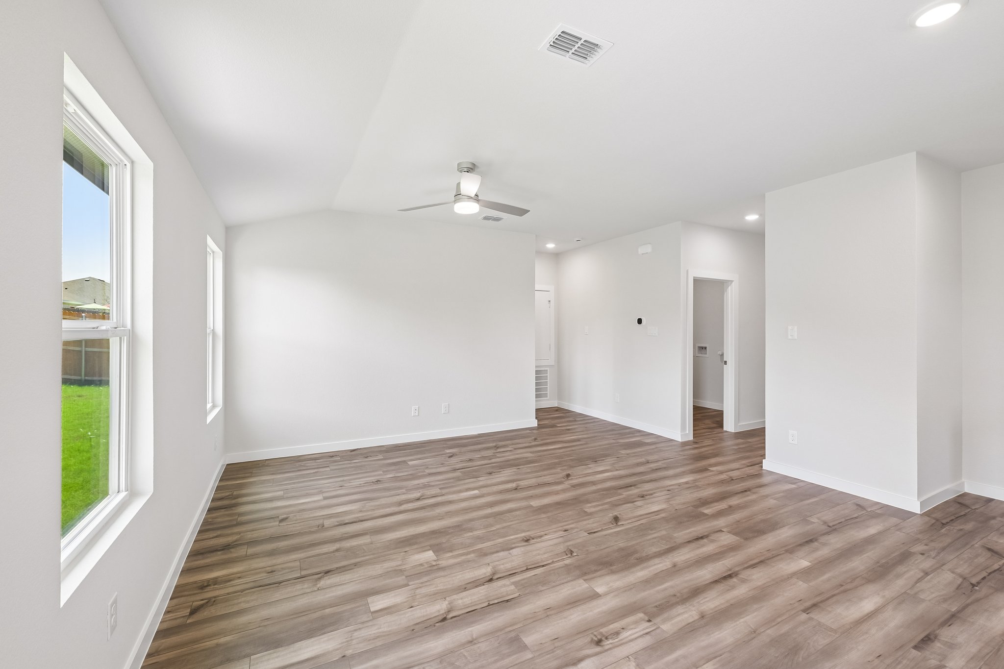 A room with a wood floor and a wood floor.