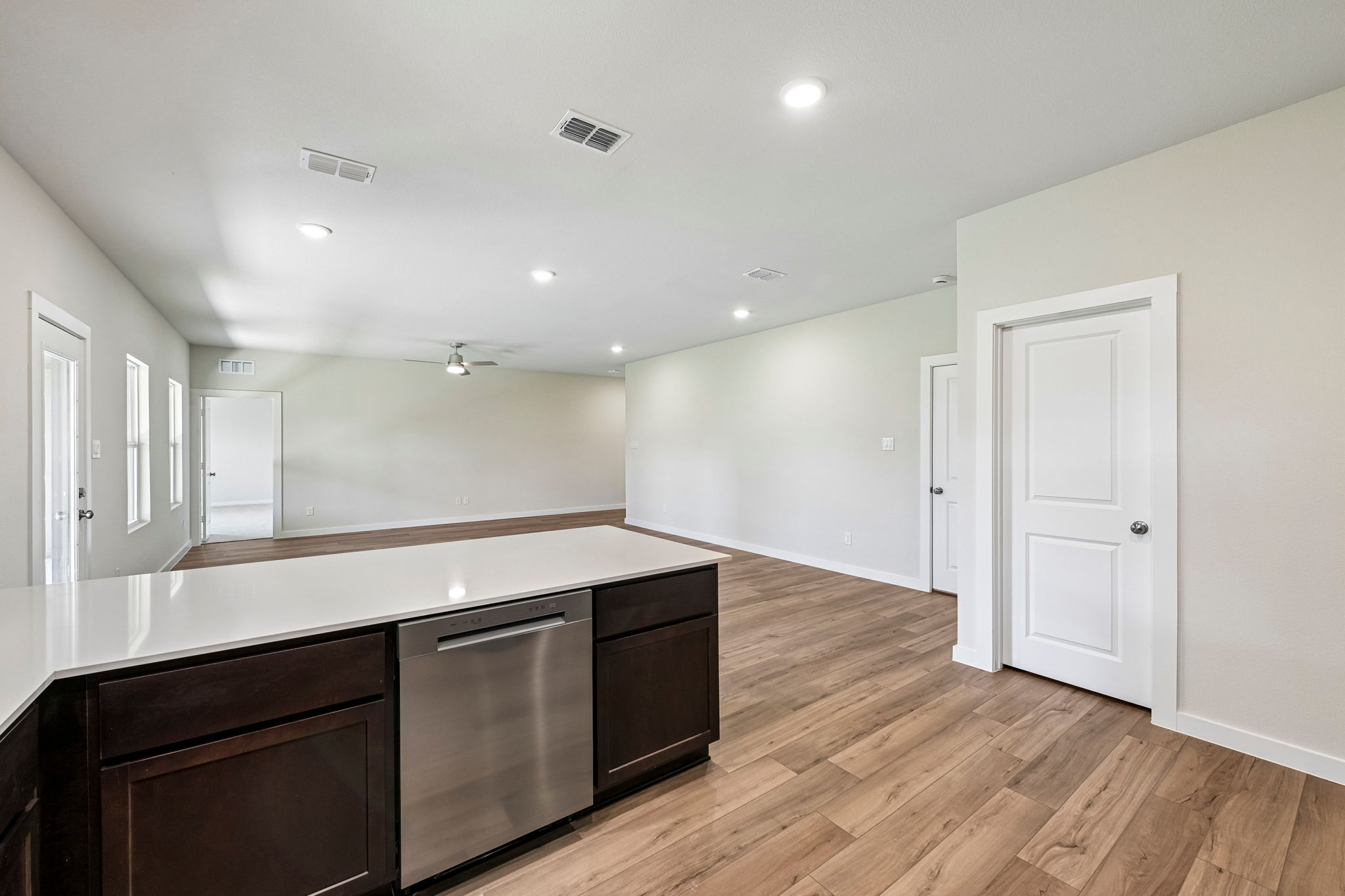 A kitchen with wooden floors.