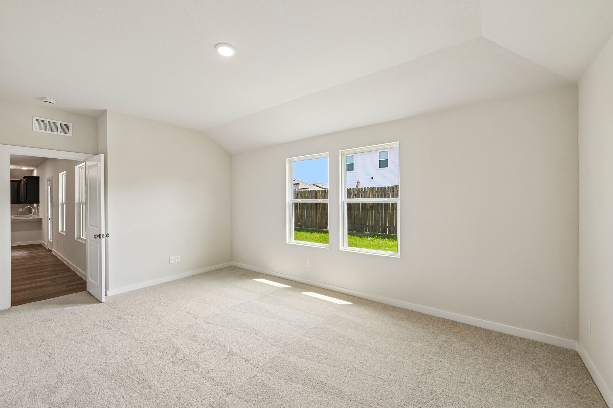 A room with a door and windows.