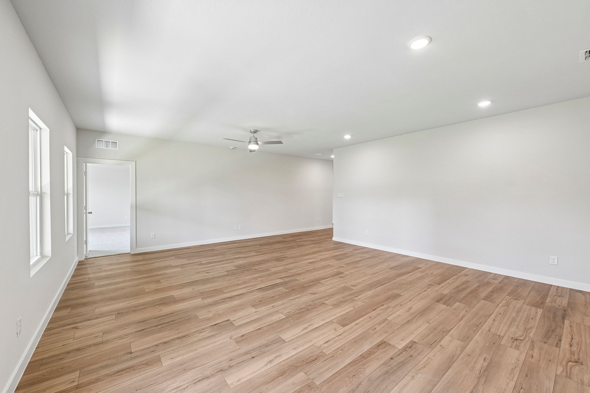 A room with a wood floor and a wood floor.