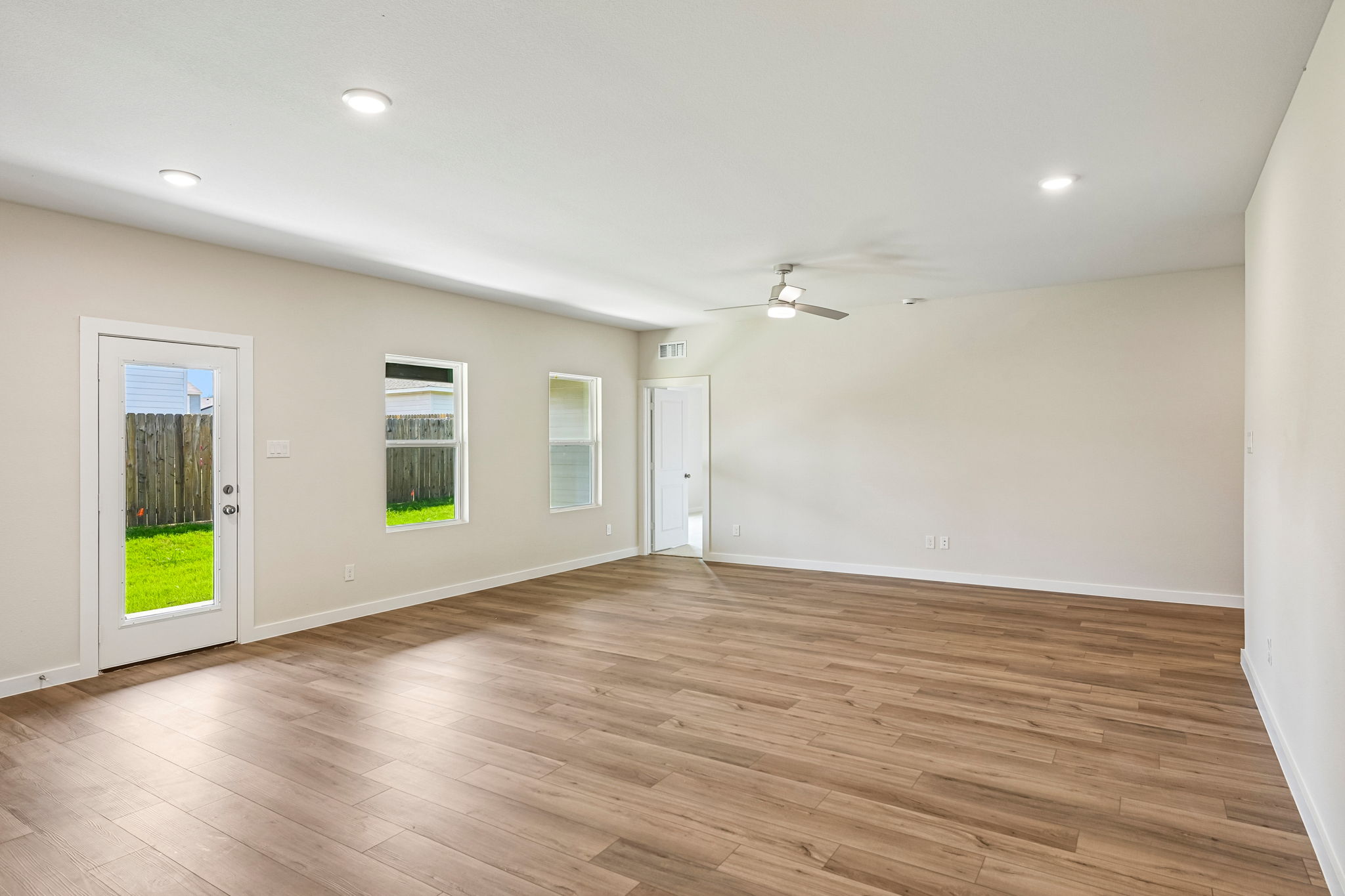 A room with a wood floor and a wood floor.