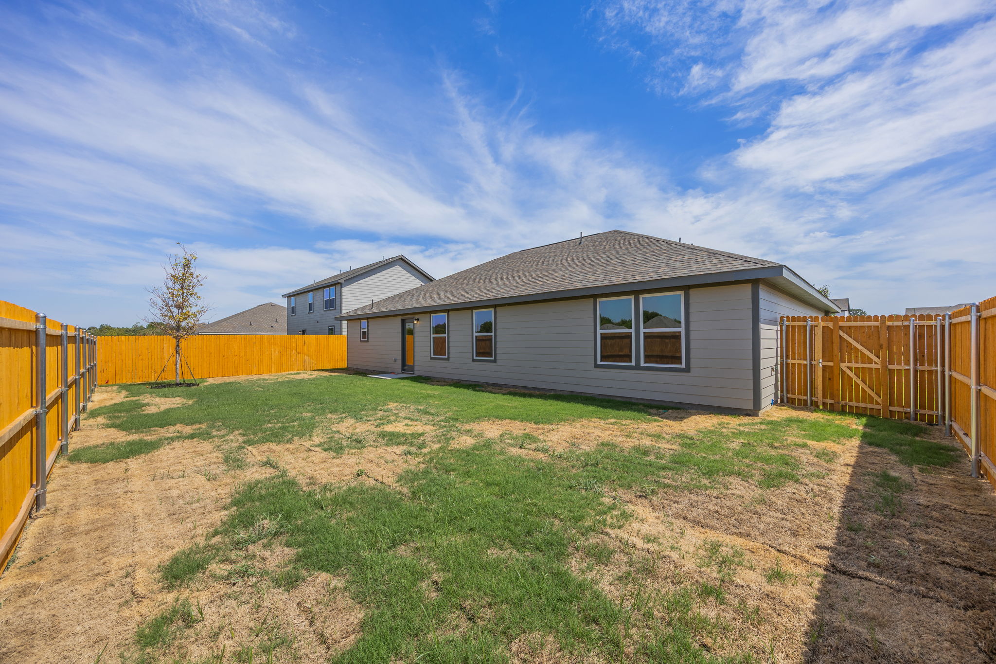 A house with a fence around it.