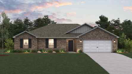 A house with a garage and a lawn in front of it.