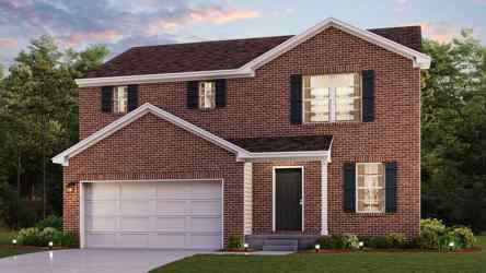 A brick house with a garage.