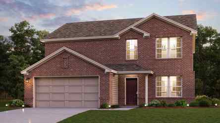 A brick house with a garage.