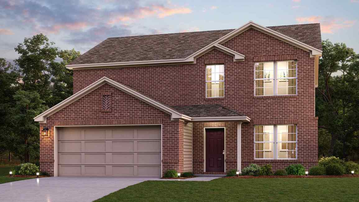 A brick house with a garage.