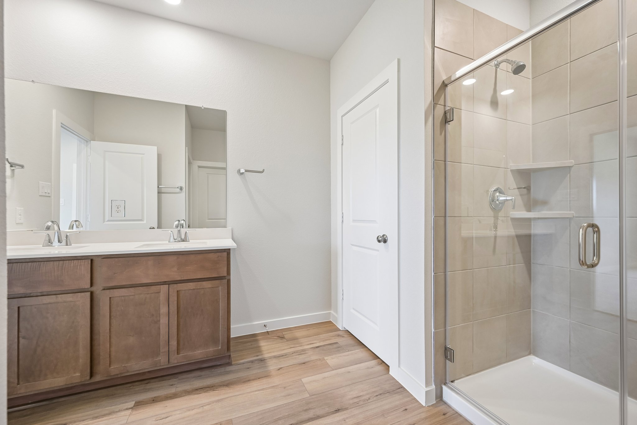 A bathroom with a glass shower.