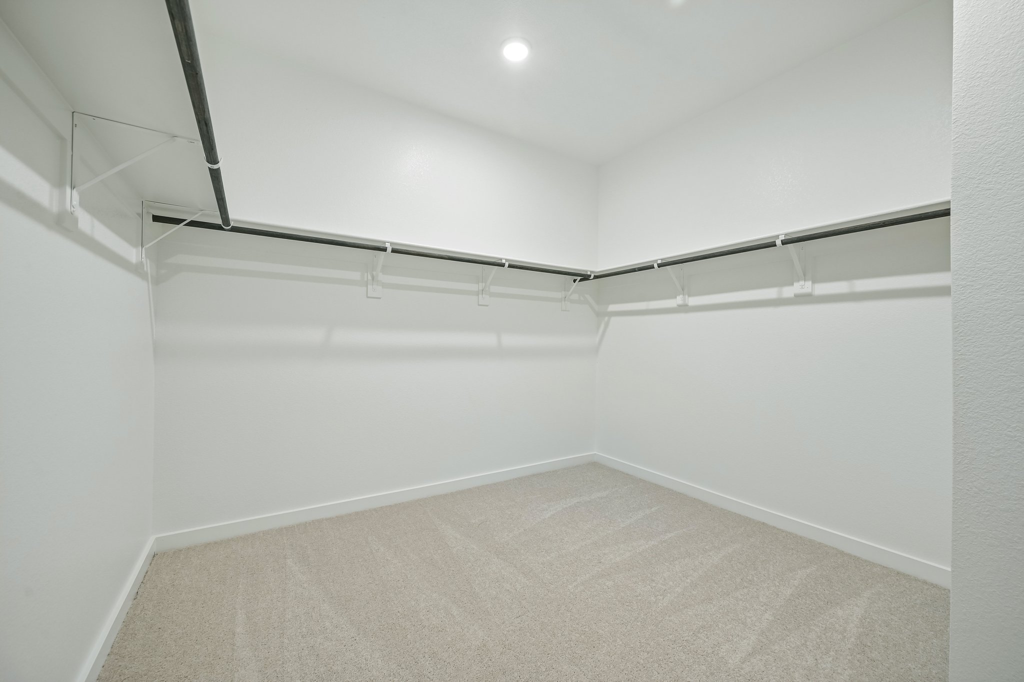 A white hallway with a light.