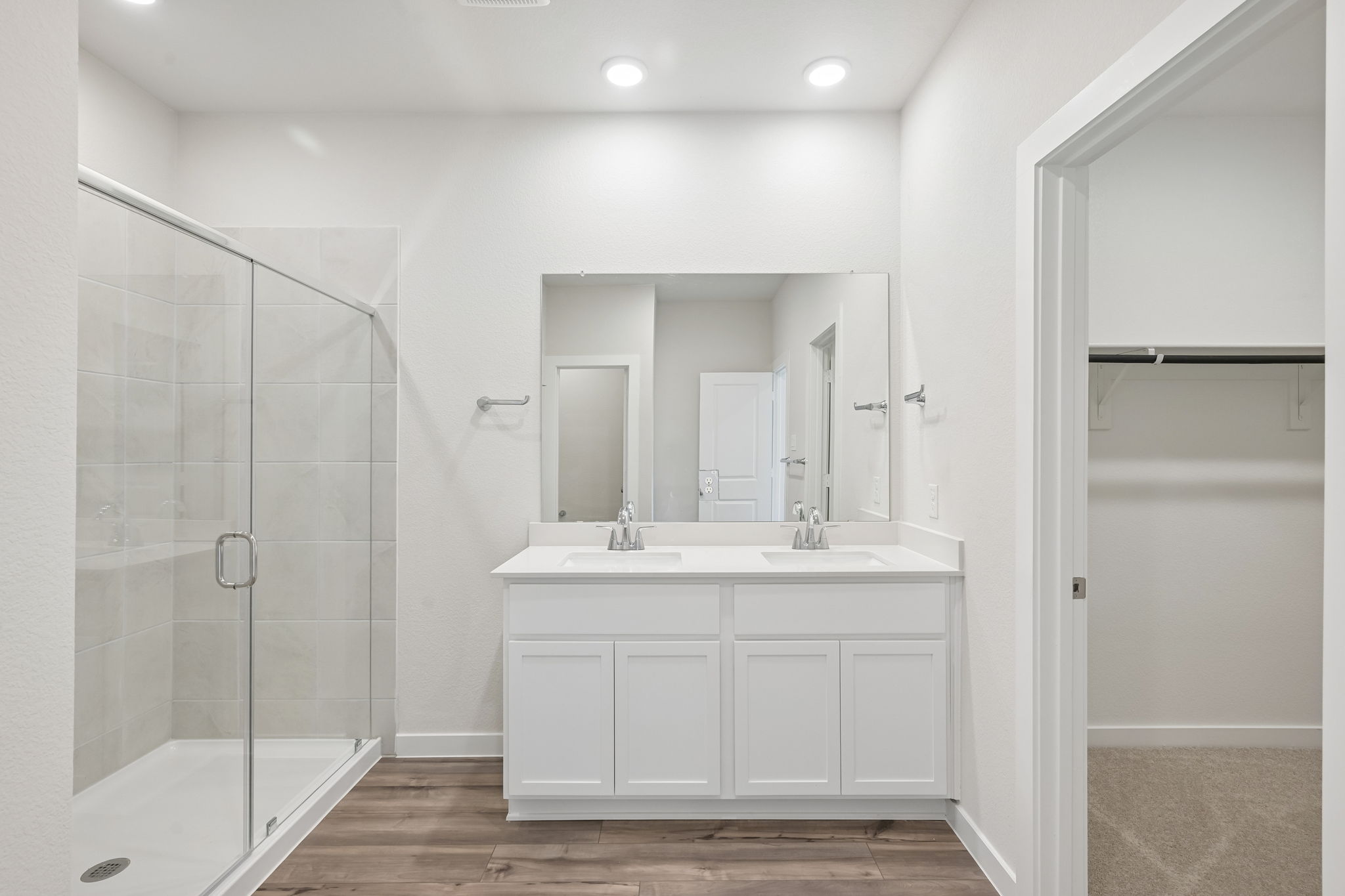 A bathroom with a glass shower.