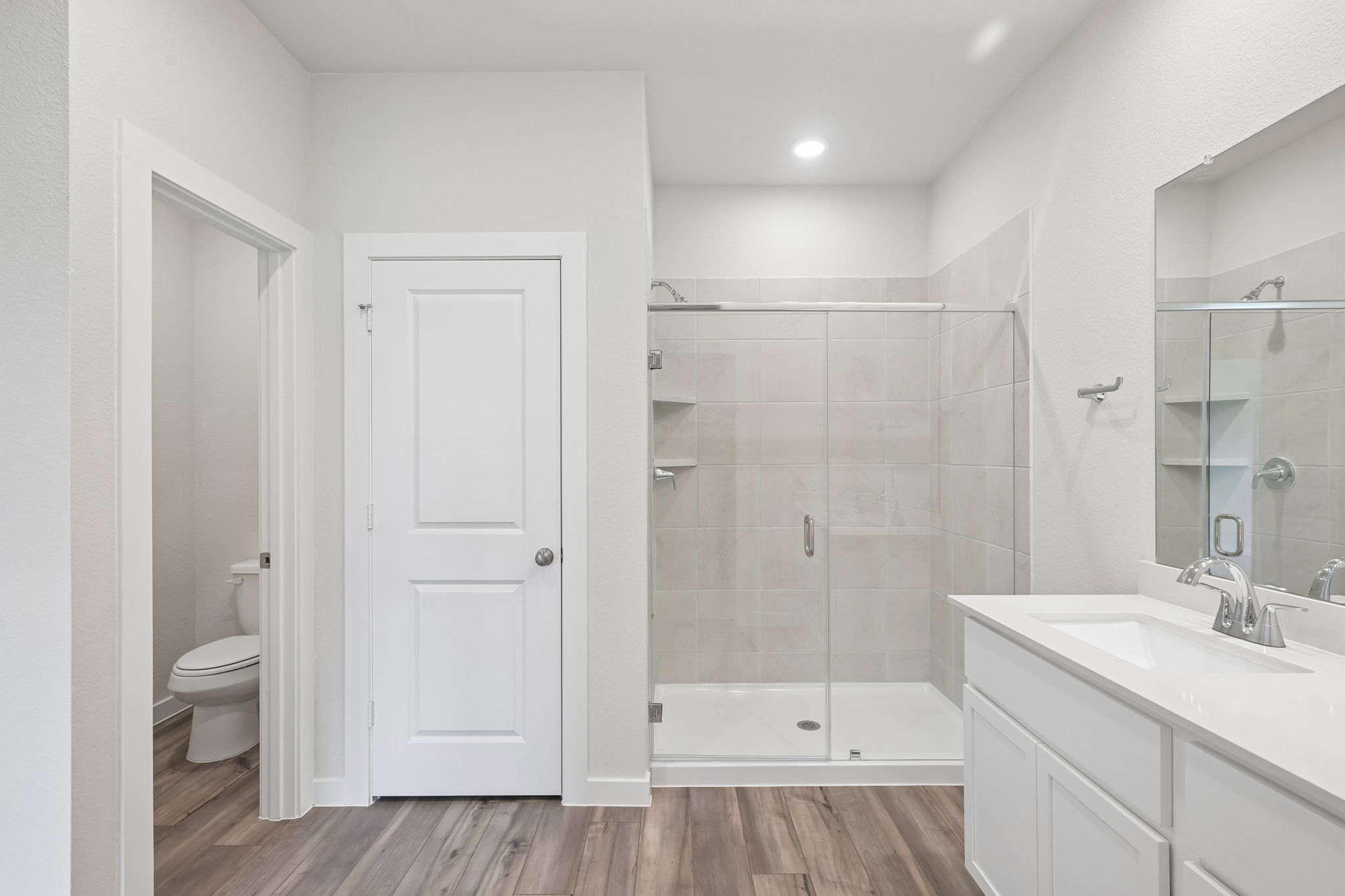 A bathroom with a glass shower.